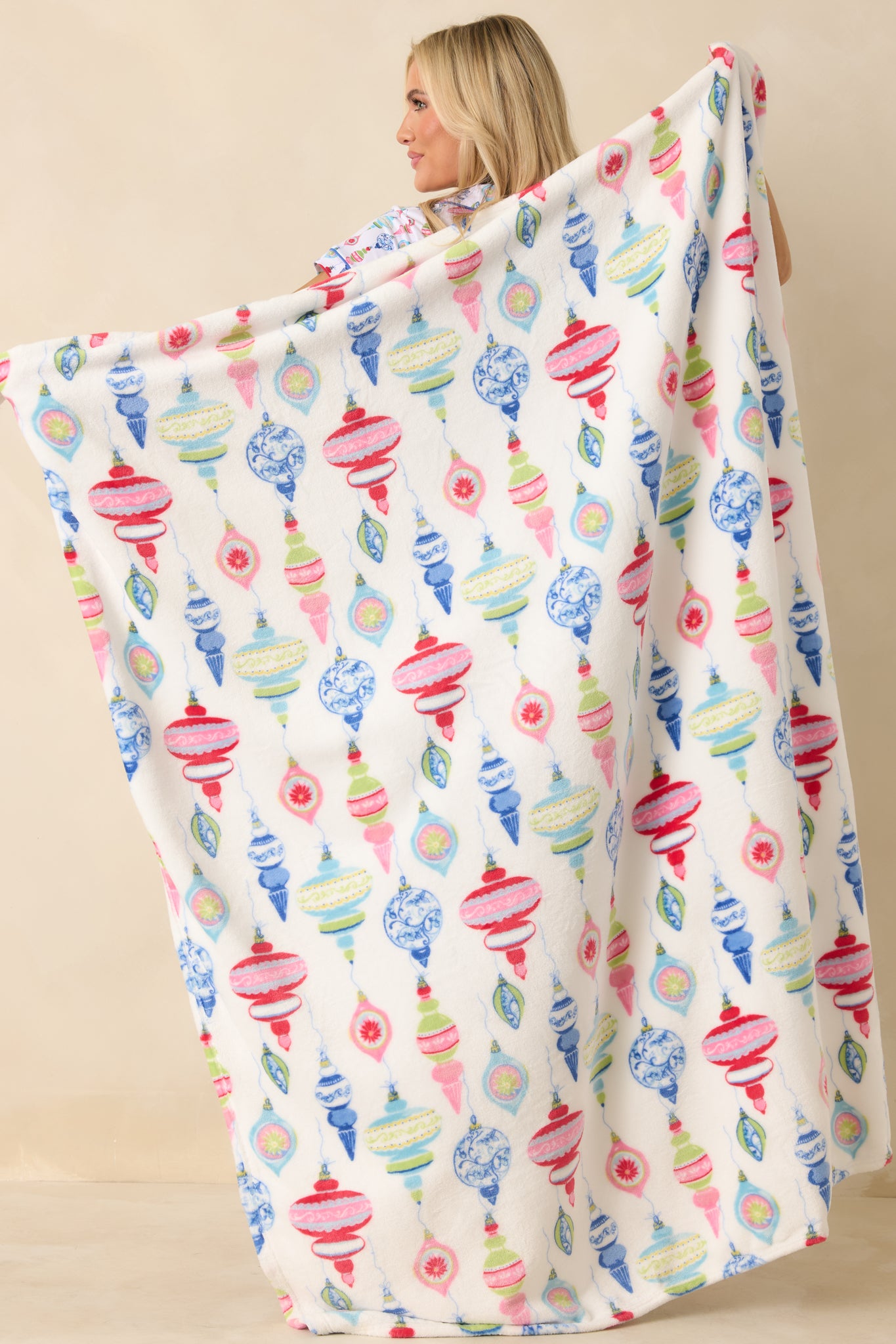 Full-length view highlighting the festive ornament pattern across the soft white fabric.