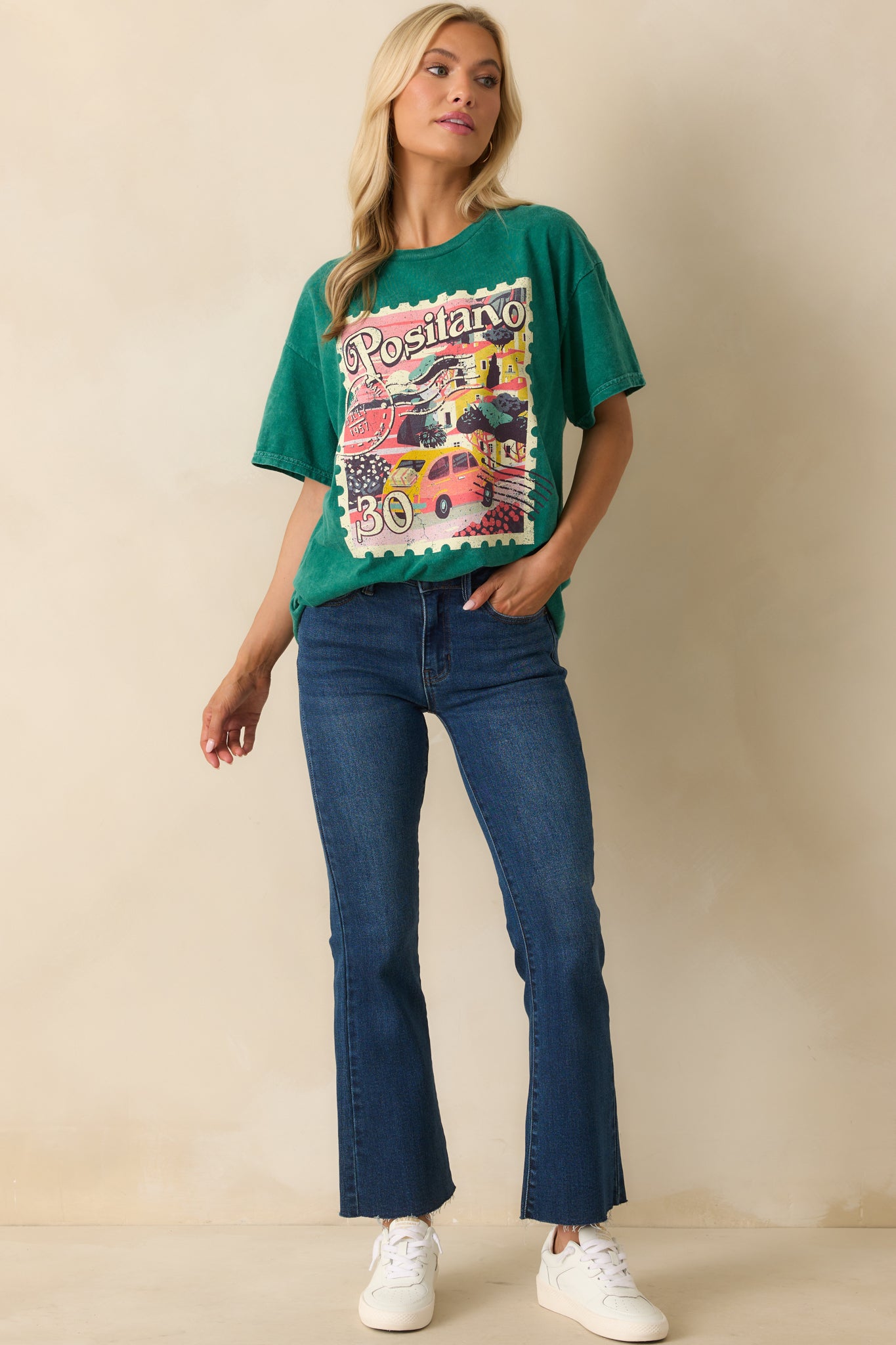 A straight-on full body photo highlighting the green acid wash fabric and centered Positano graphic.