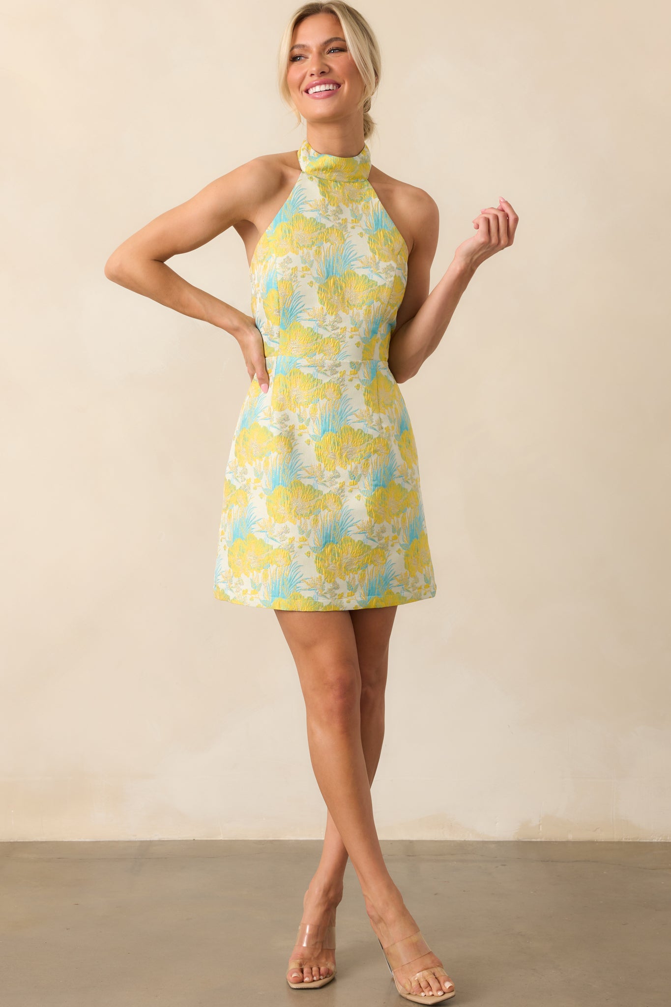 Front-facing full body photo showcasing the vibrant jacquard fabric, fitted mini length, and tropical palm motif.