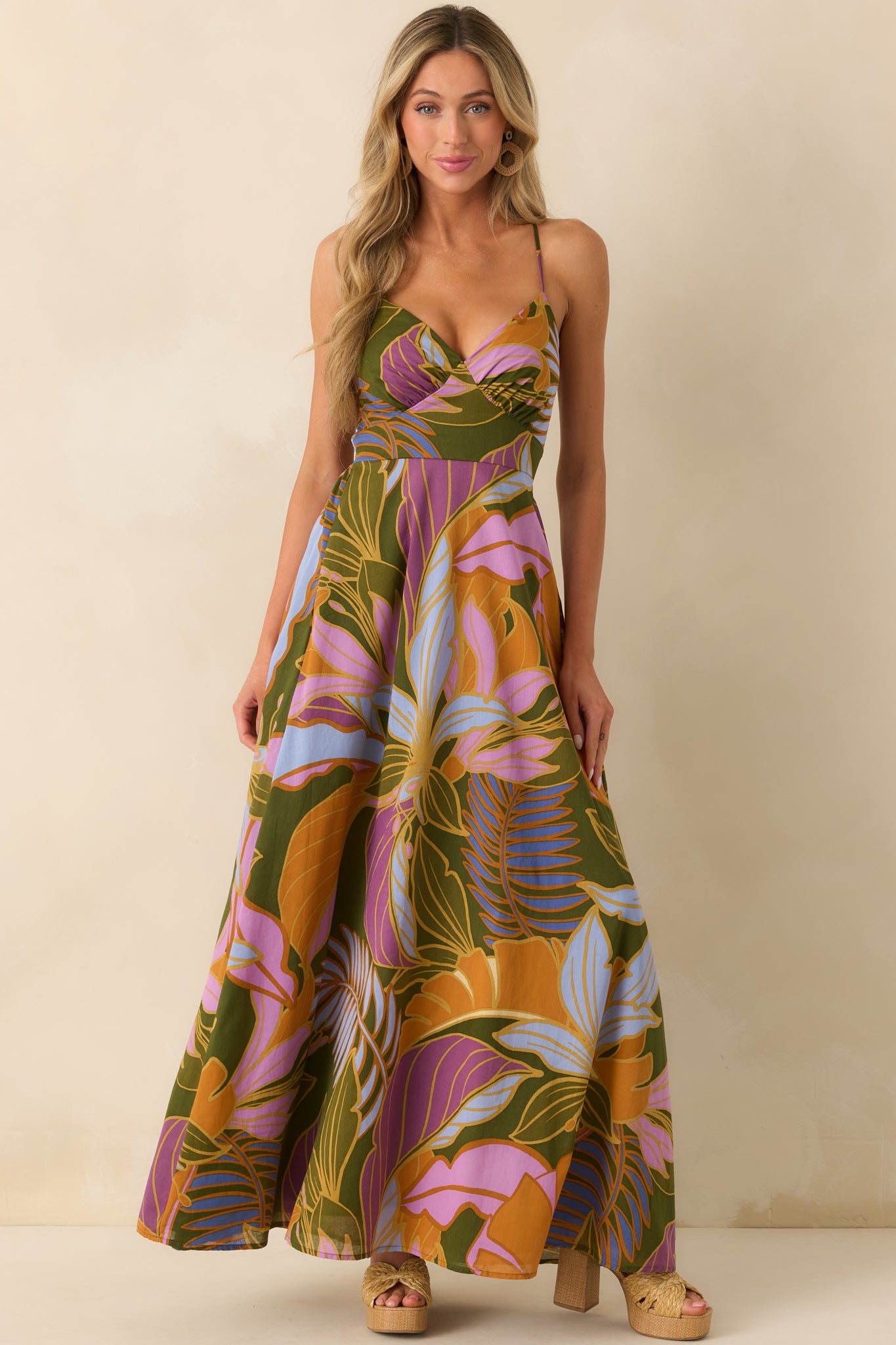 Front-facing full body shot highlighting the paneled bodice design and flowing maxi length.