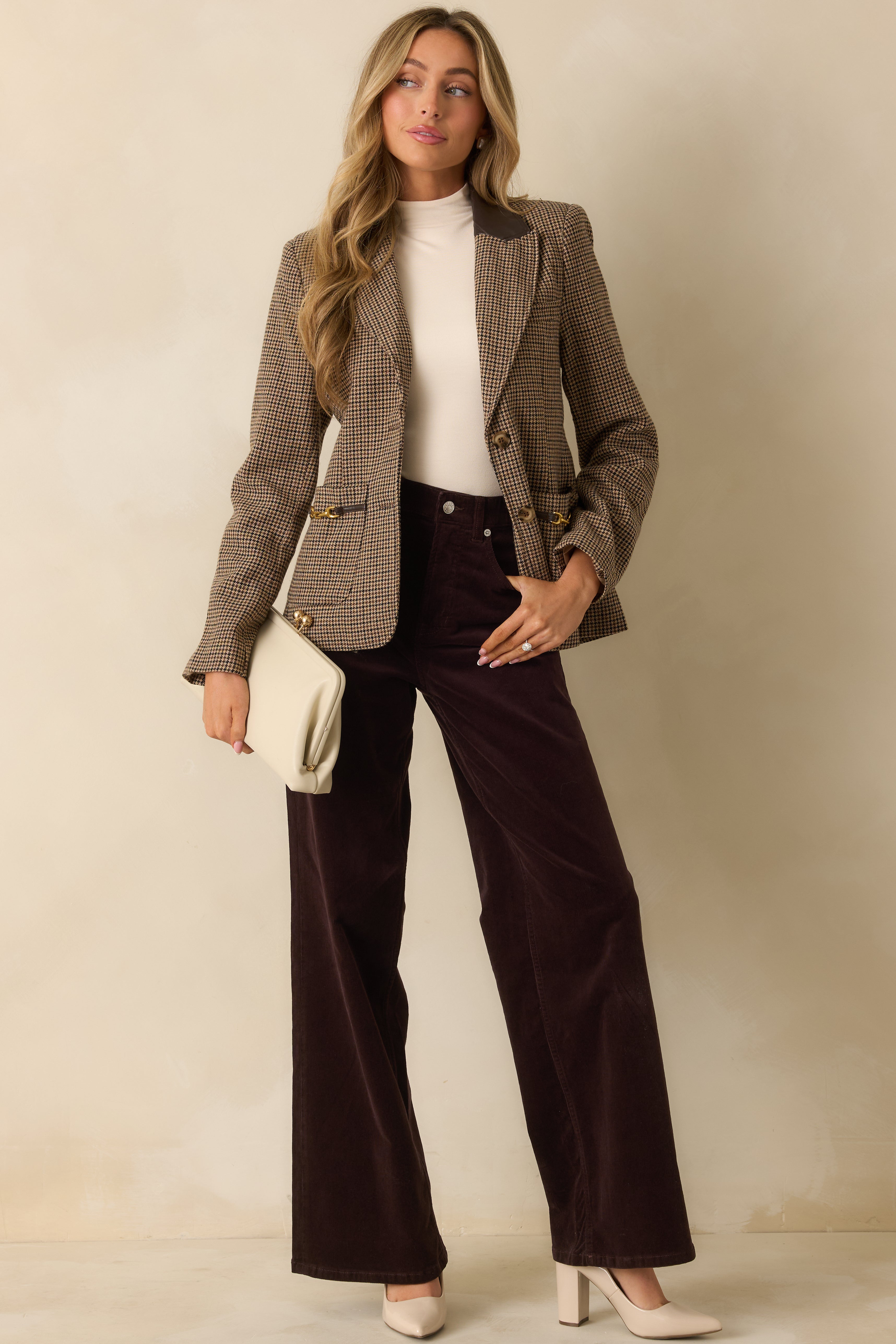 Full view of the dark brown corduroy pants showing the high waist, belt loops, and smooth drape of the wide legs.