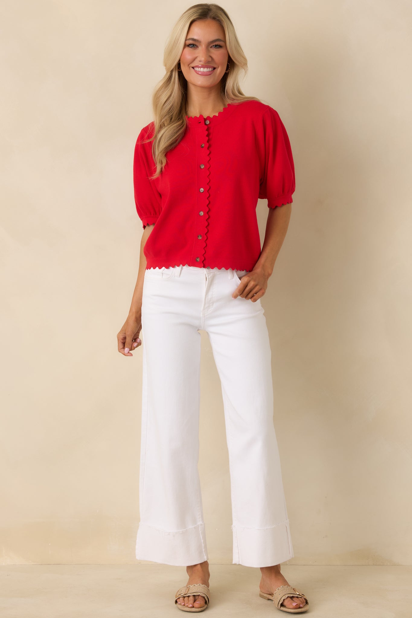 Front-facing full-length view emphasizing the feminine silhouette and decorative scalloped edges throughout the cardigan.