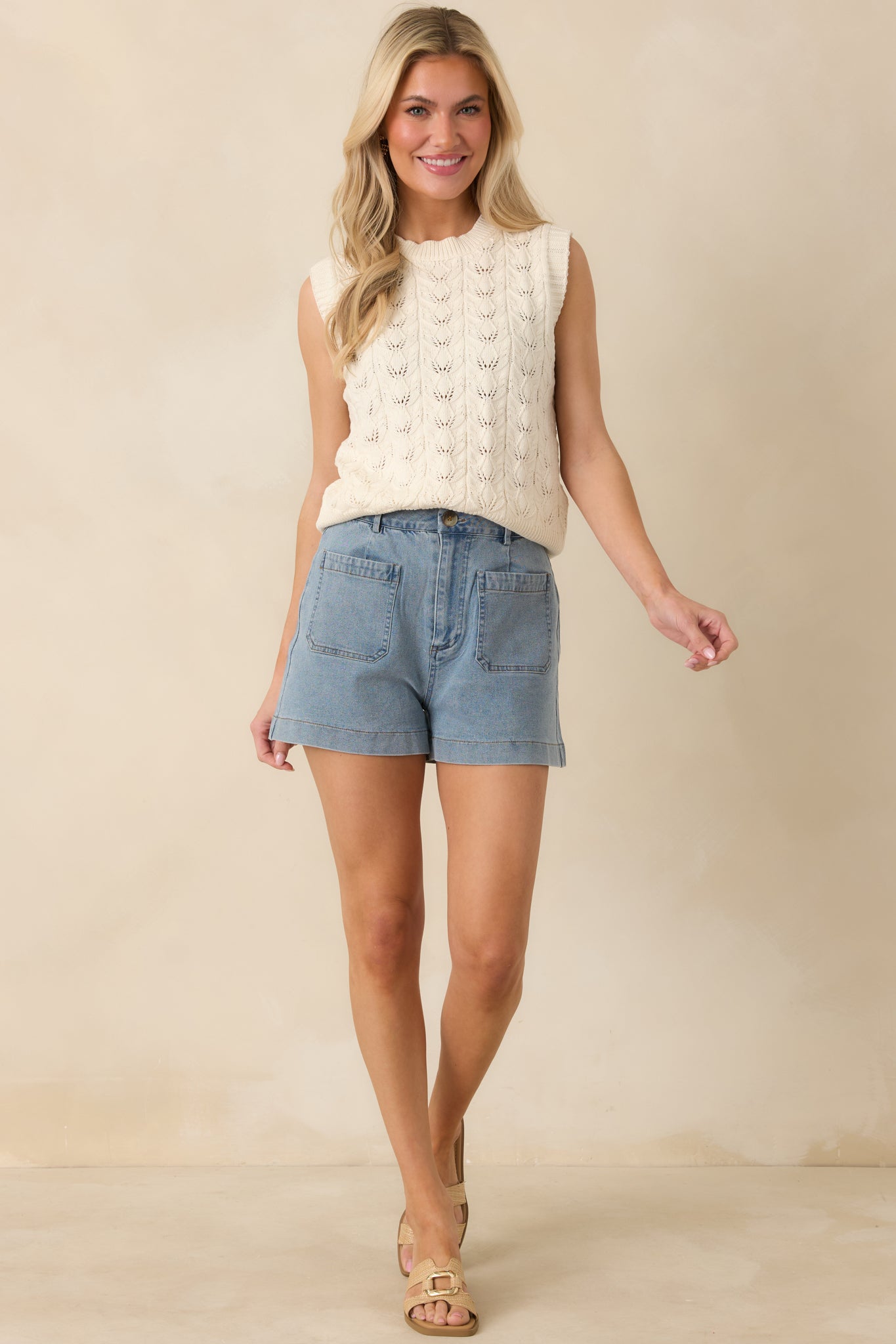 Full body front view emphasizing the soft midweight knit and easy, layered fit of the vest.