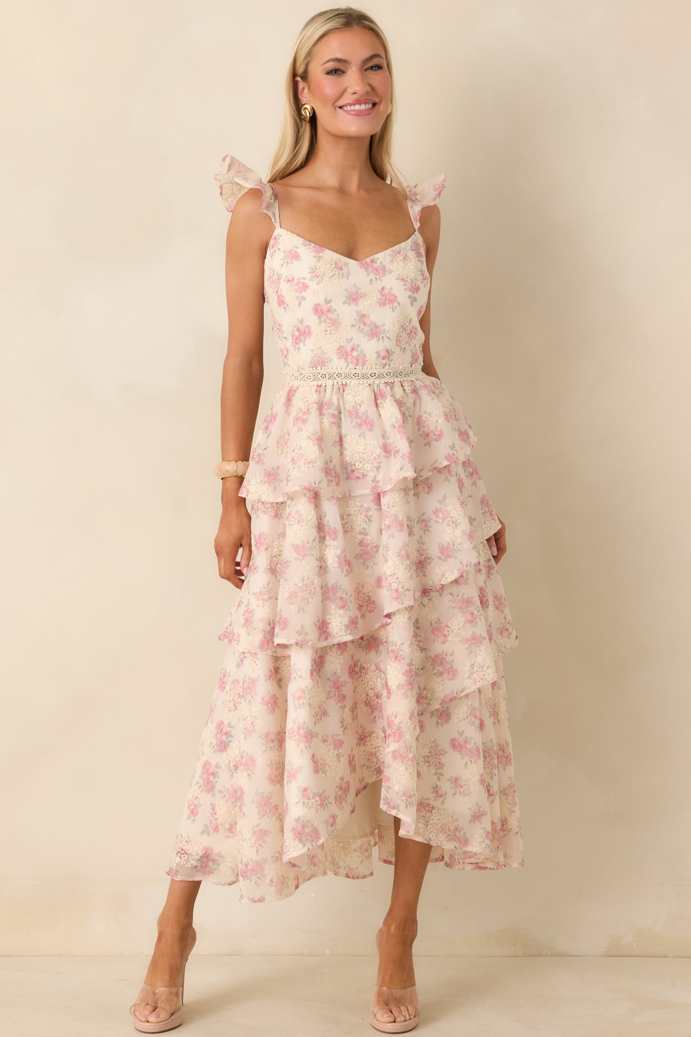 Full body front view highlighting the beige embroidered floral details layered over the floral pattern.