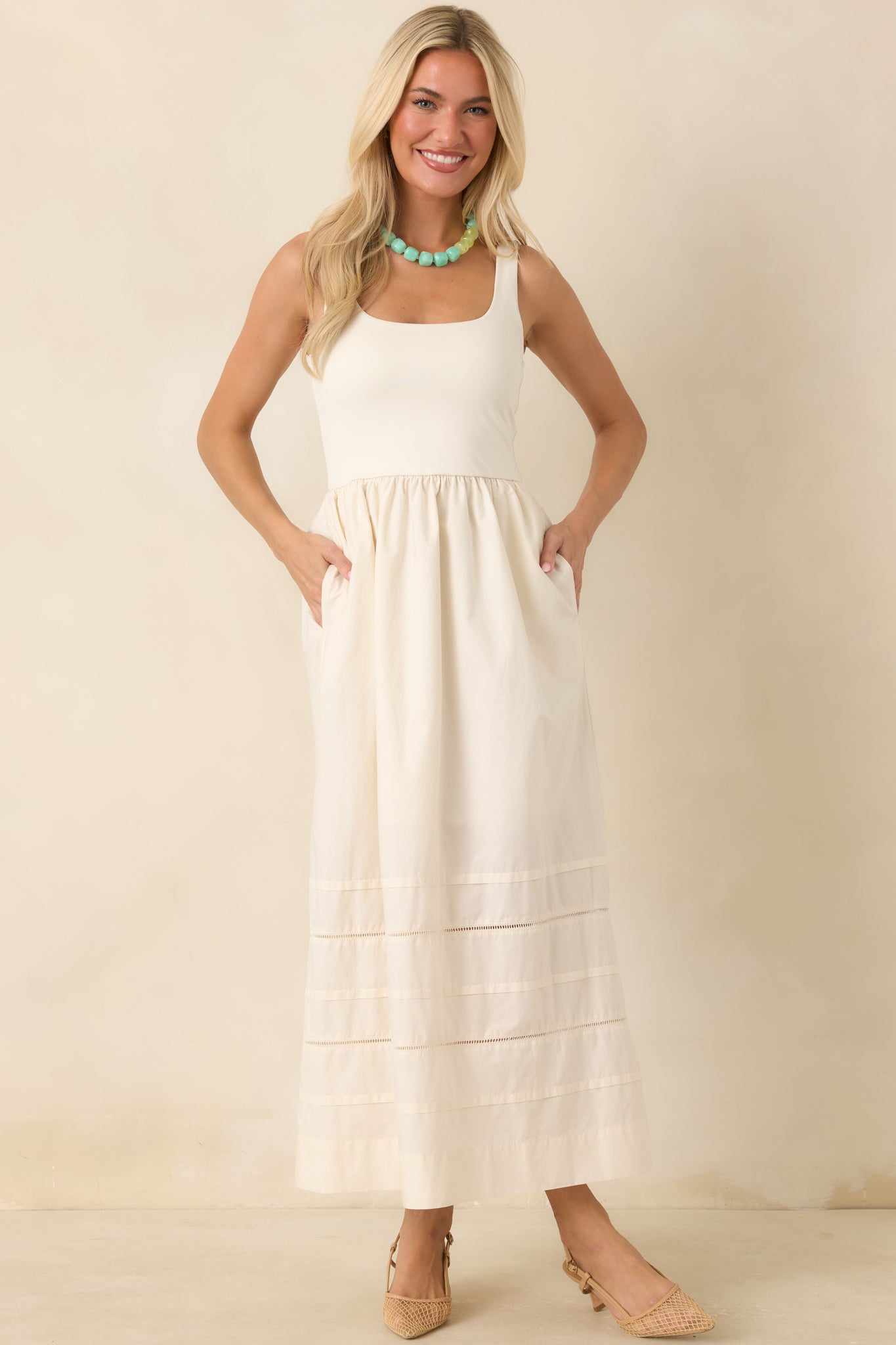 Full view highlighting the fitted, stretchy bodice features a flattering scoop neckline and sleeveless silhouette, with a gathered cotton poplin skirt.