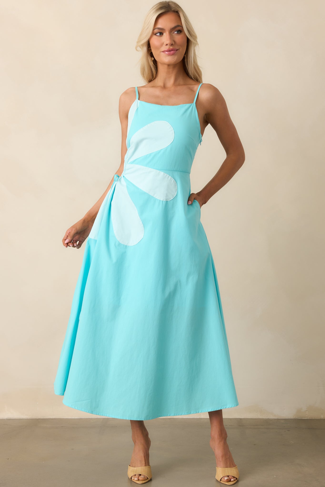 Full-length front view of a horizon blue maxi dress featuring a square neckline and flowing silhouette.