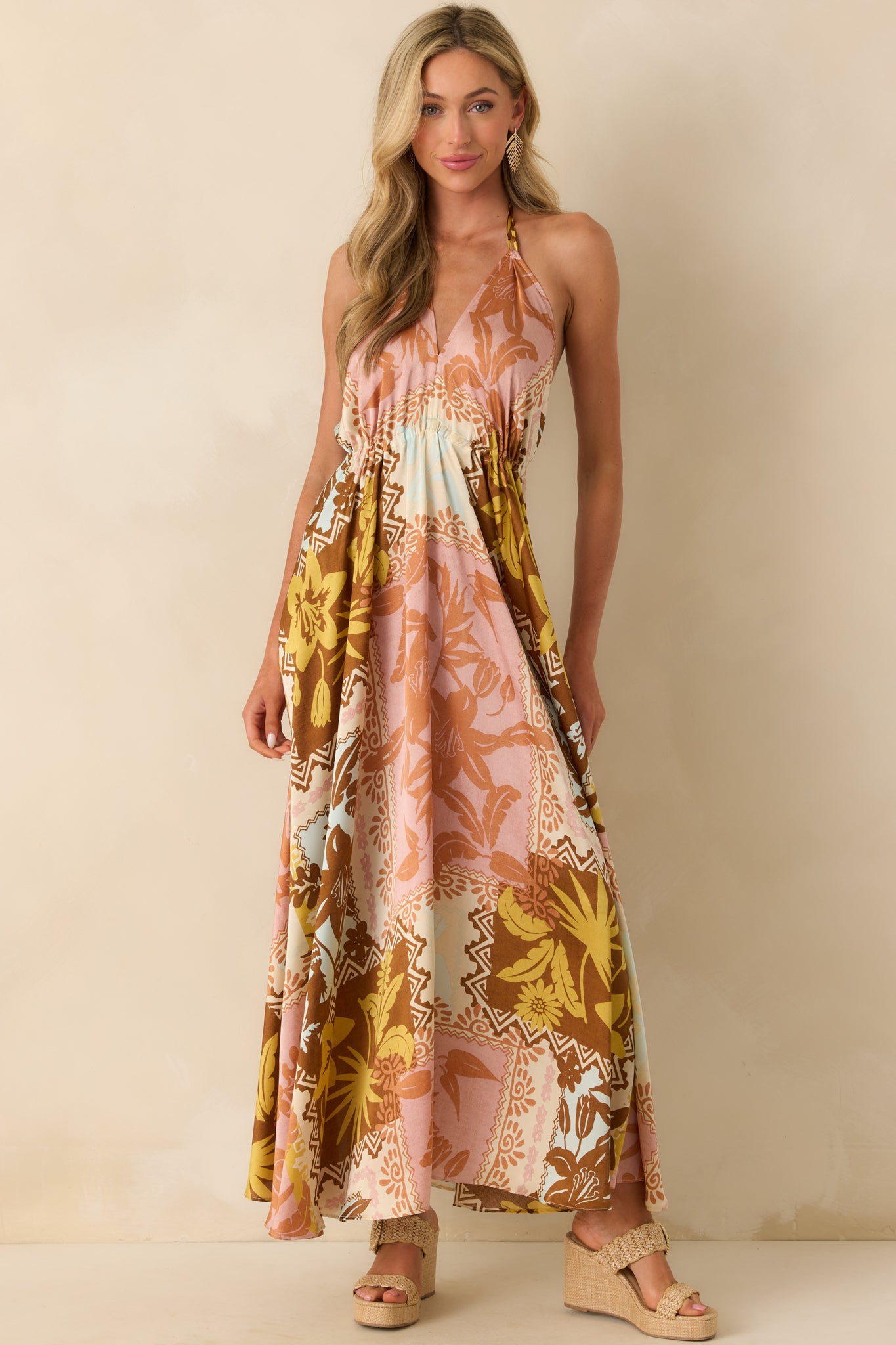 Full body view emphasizing the neckline and print variation across the front of the satin-like maxi dress.