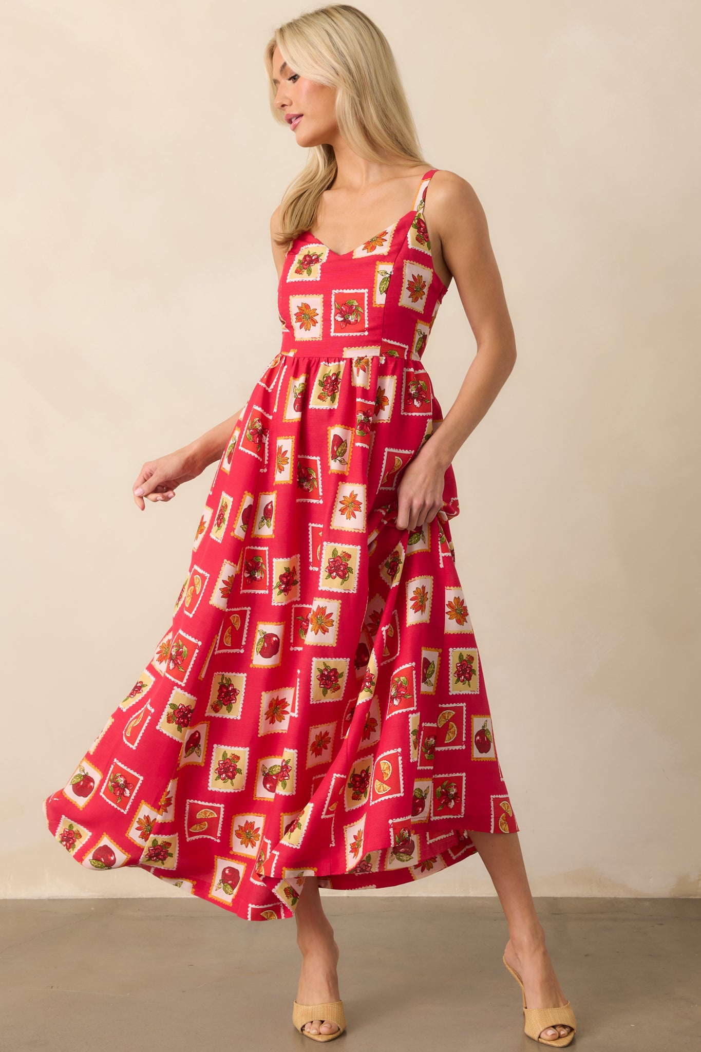 Close to full length view showcasing the colorful patchwork print and silhouette of the dress.
