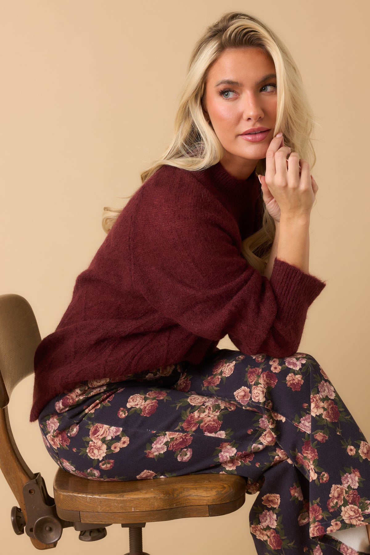 Softly fuzzy mohair-wool blend top featuring a ribbed mock neckline, relaxed raglan sleeves, and cable detailing.