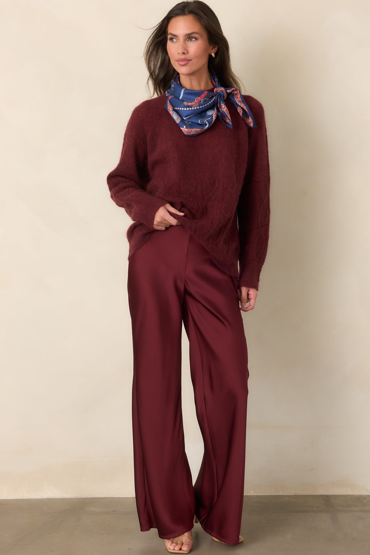 Lightweight semi-sheer knit top showcasing the cozy fuzzy texture, mock neckline, and intricate cable pattern.