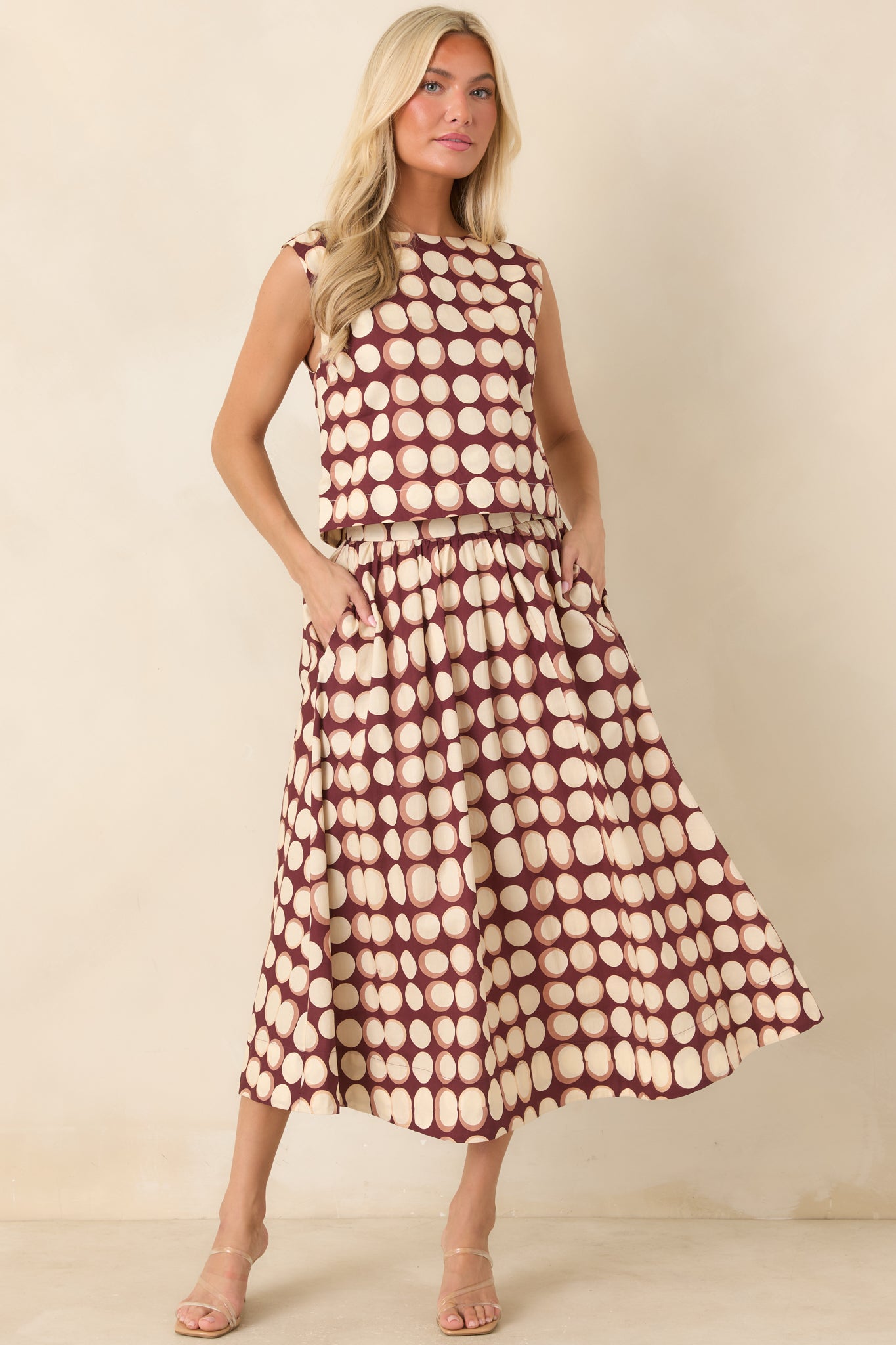 Softly gathered cotton skirt designed with a comfortable elasticized back waistband, full shape, side pockets, and smooth lining.