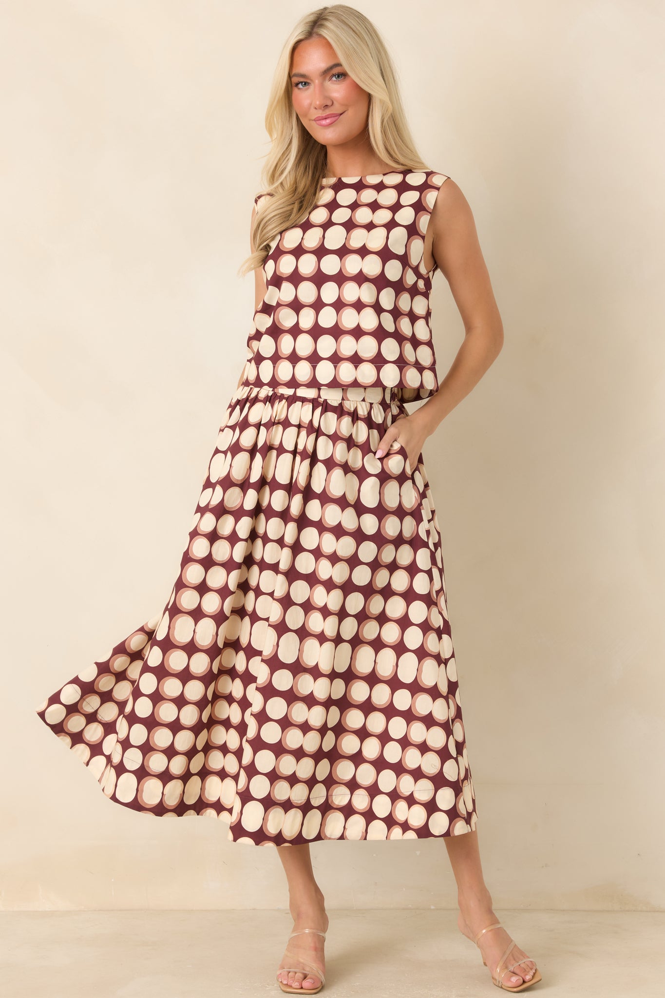 Full A-line skirt showcasing a smooth flat waistband, gathered fabric, practical side pockets, and a flowing silhouette.