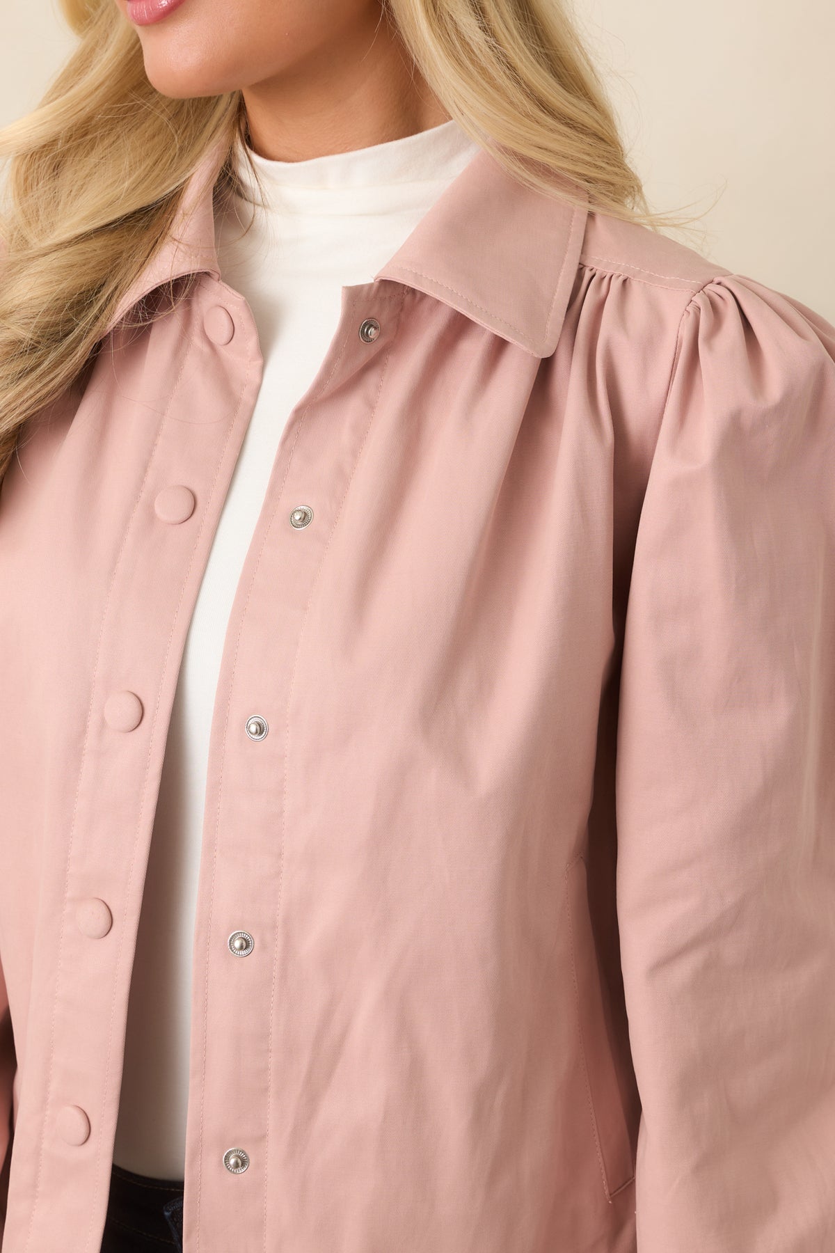 Close-up highlighting the gathered shoulder construction and elasticized puff sleeve cuff.