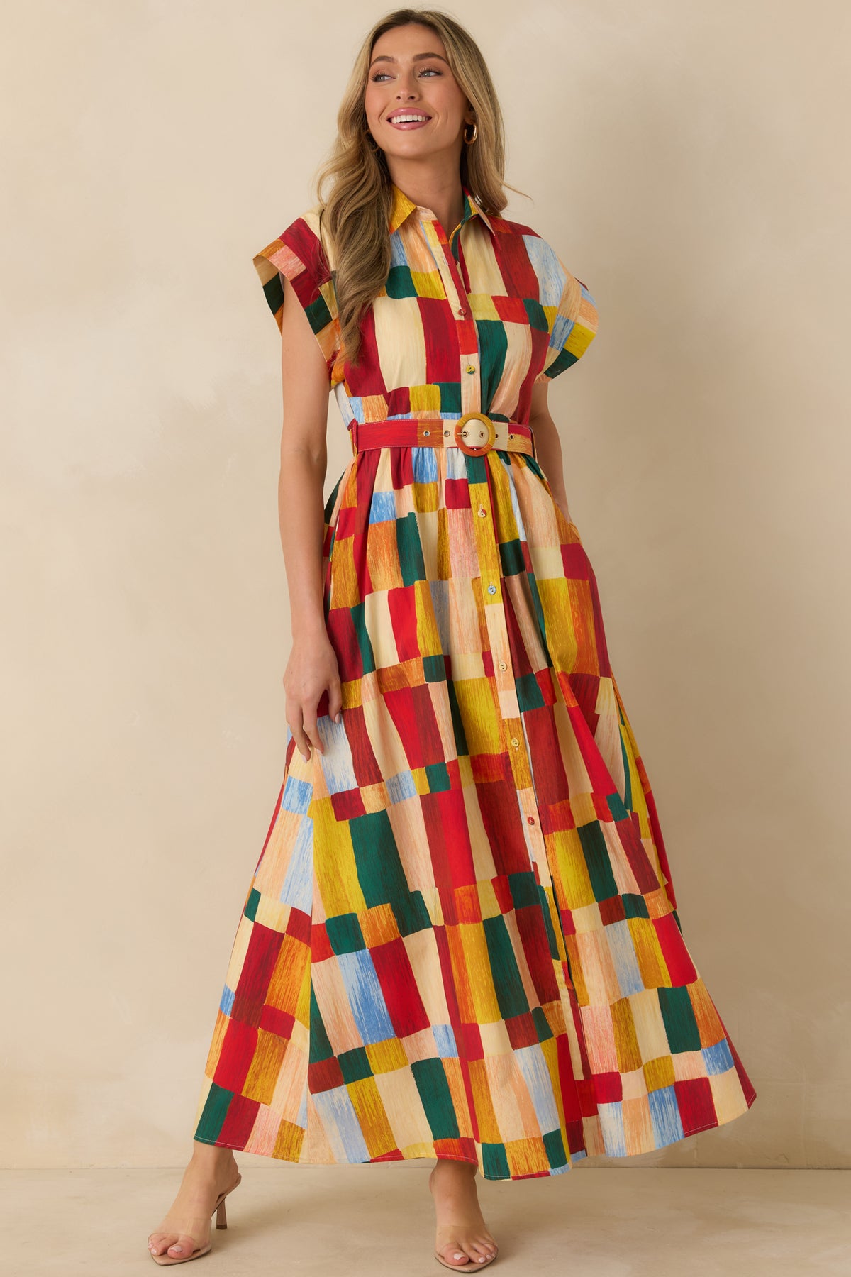 Multicolor geometric print maxi shirt dress featuring a collared neckline, matching waist belt, button front, and full skirt.