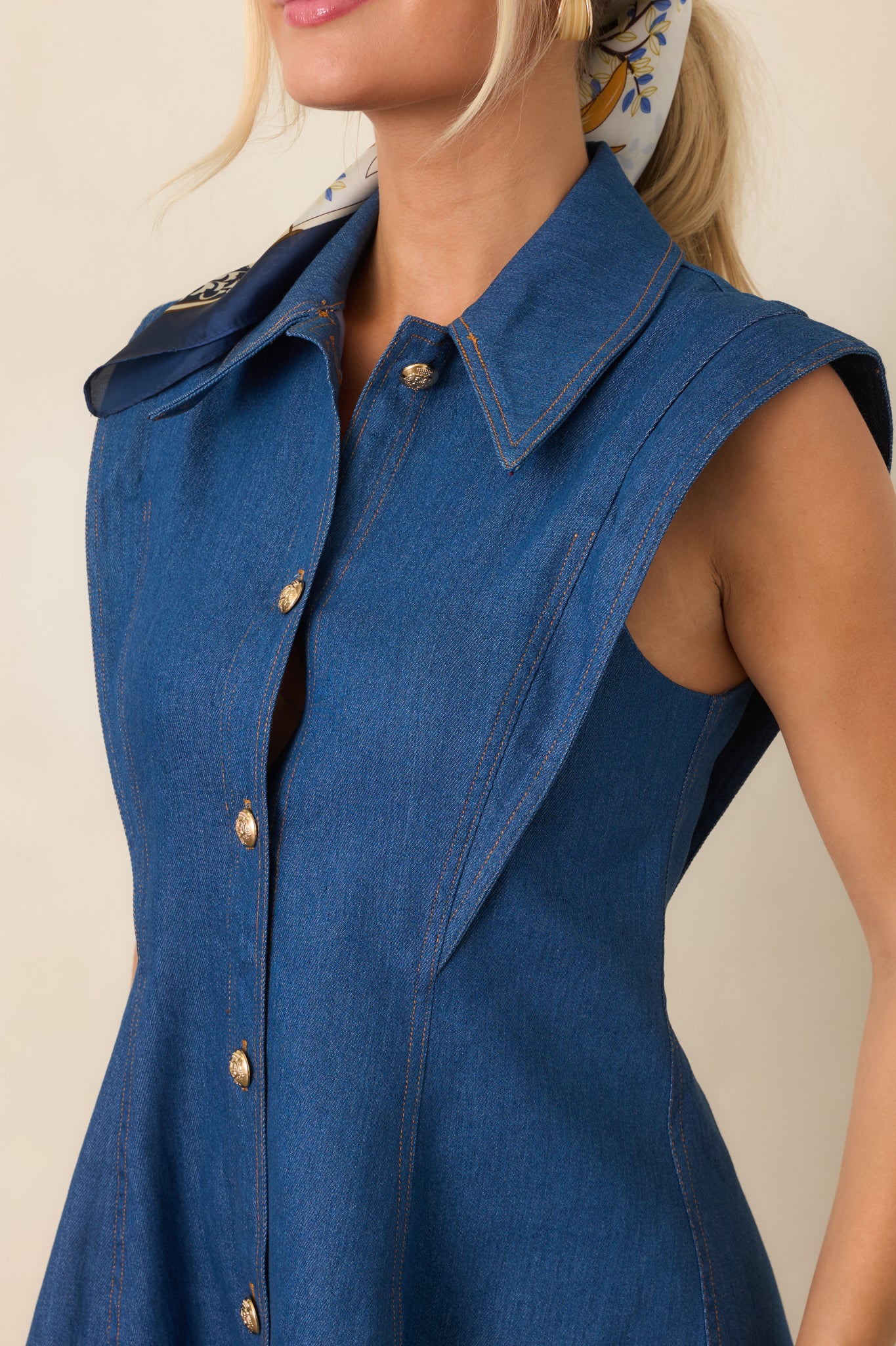 Close-up of the pointed collar, gold-tone buttons, and structured cotton-blend fabric, highlighting the polished construction.