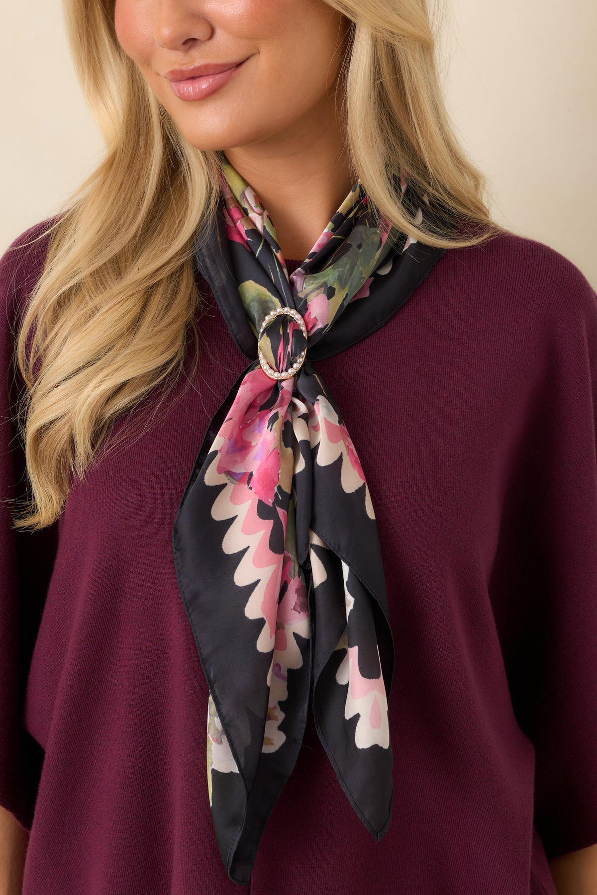 Gold-tone oval scarf accessory showcases delicate pearl detailing along its frame with an open center for displaying scarf fabric.