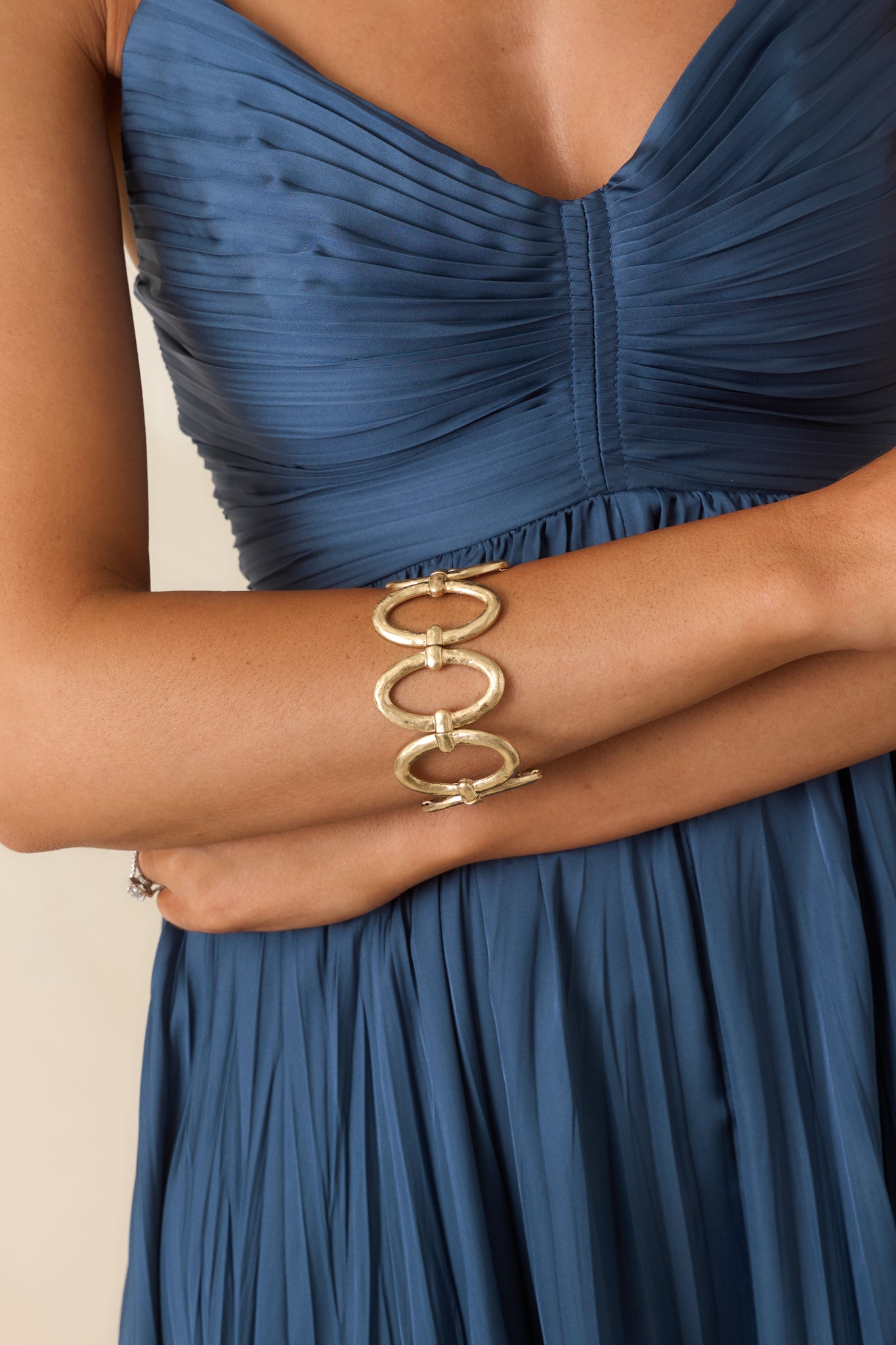 Gold stretch bracelet featuring oversized oval links and a textured metallic finish for a bold statement look.