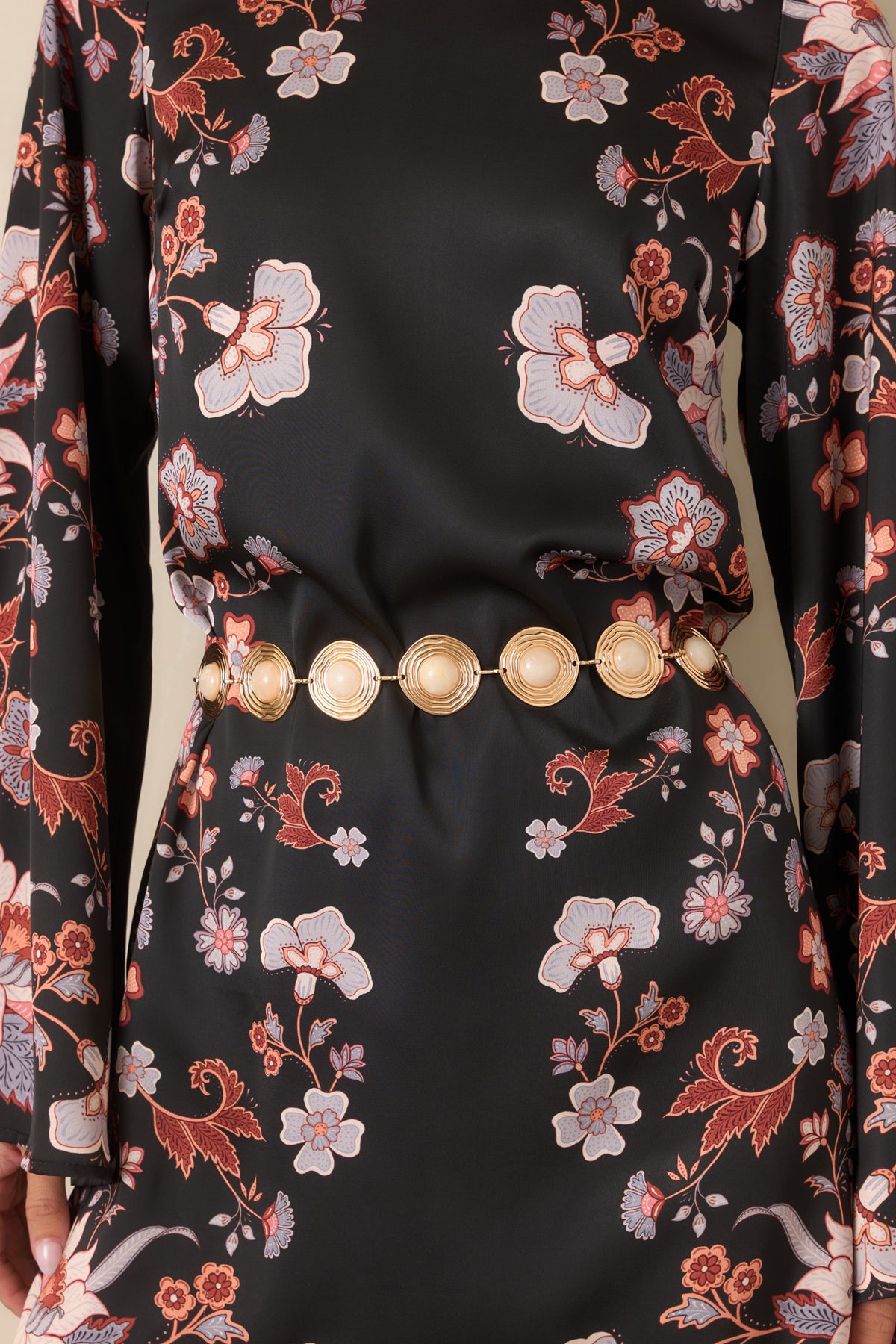 Gold-tone linked medallions showcase rounded ivory centers with varied marbled patterns and sculpted detailing.