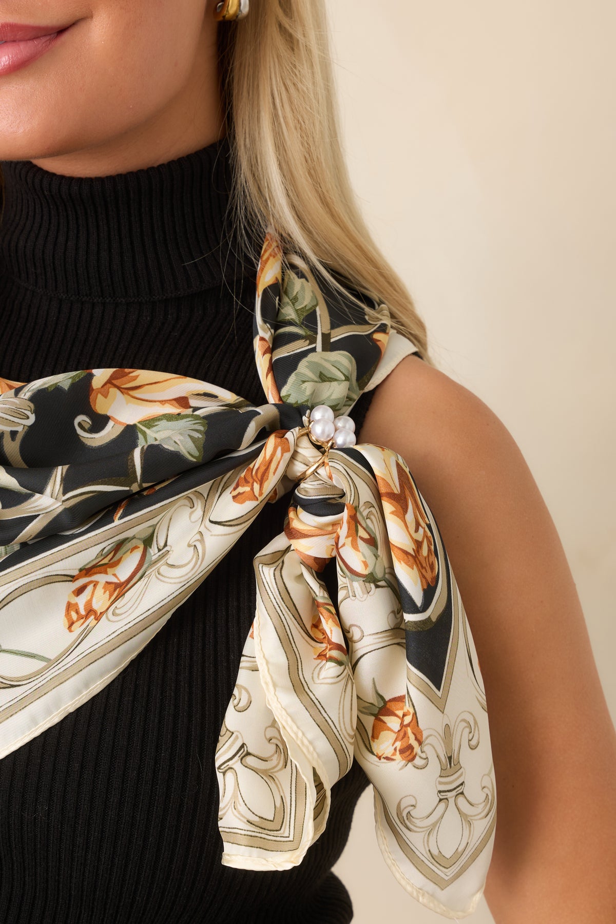 Gold-tone scarf accessory with four pearl accents arranged in a clustered setting and decorative open-sided construction.