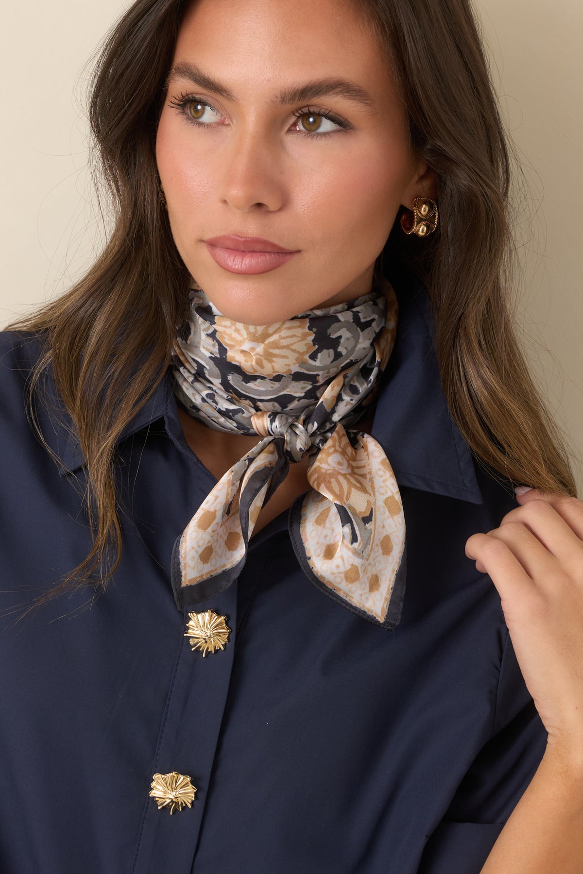 Close-up of the golden beige florals, winding ivory and sage vines, and ornate border detailing.
