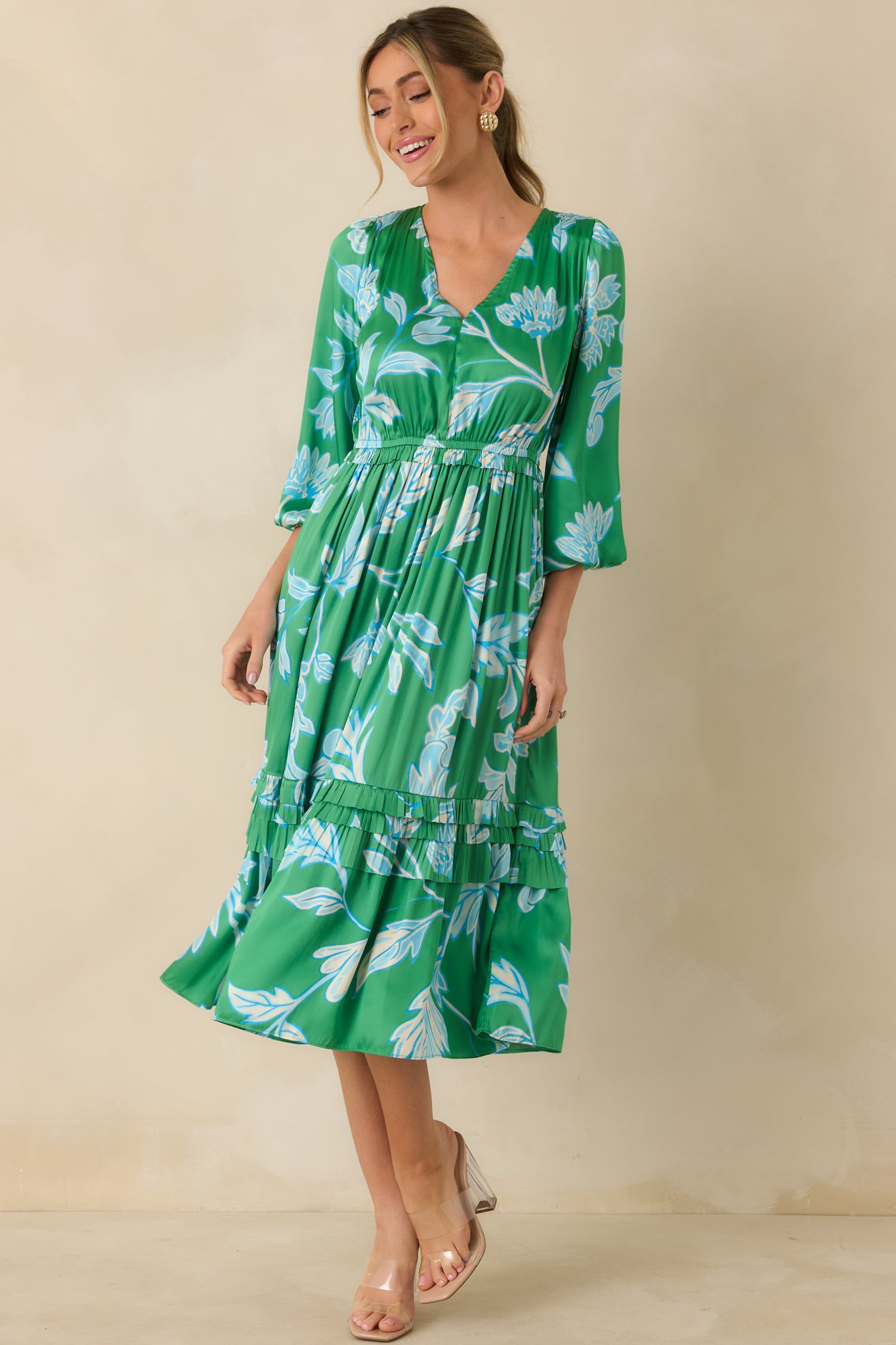 Full-length front view of green and blue midi dress showcasing tiered ruffle detailing and relaxed silhouette.