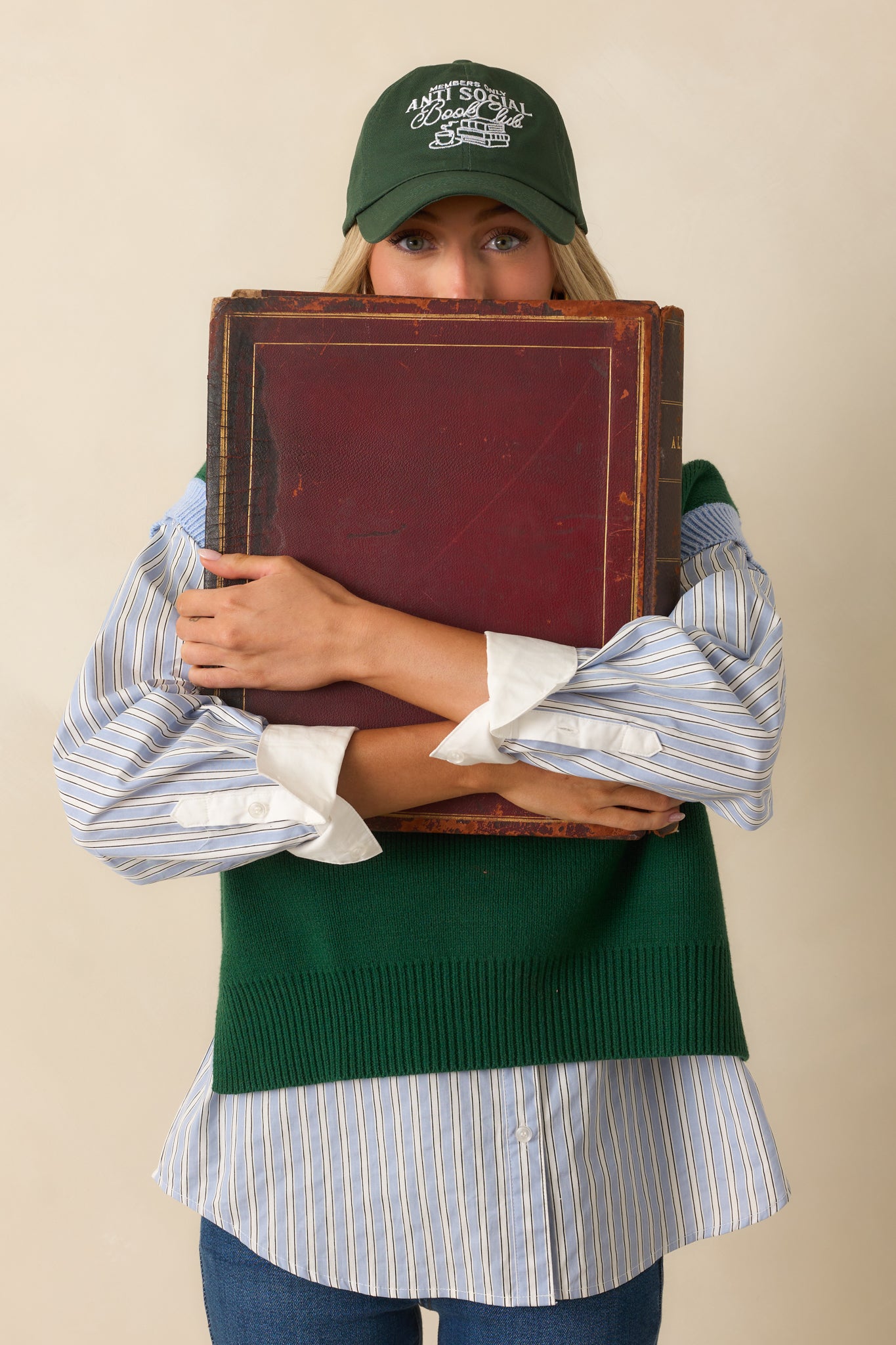 A straight-on shot of the baseball cap, capturing its rich green hue and curved brim.