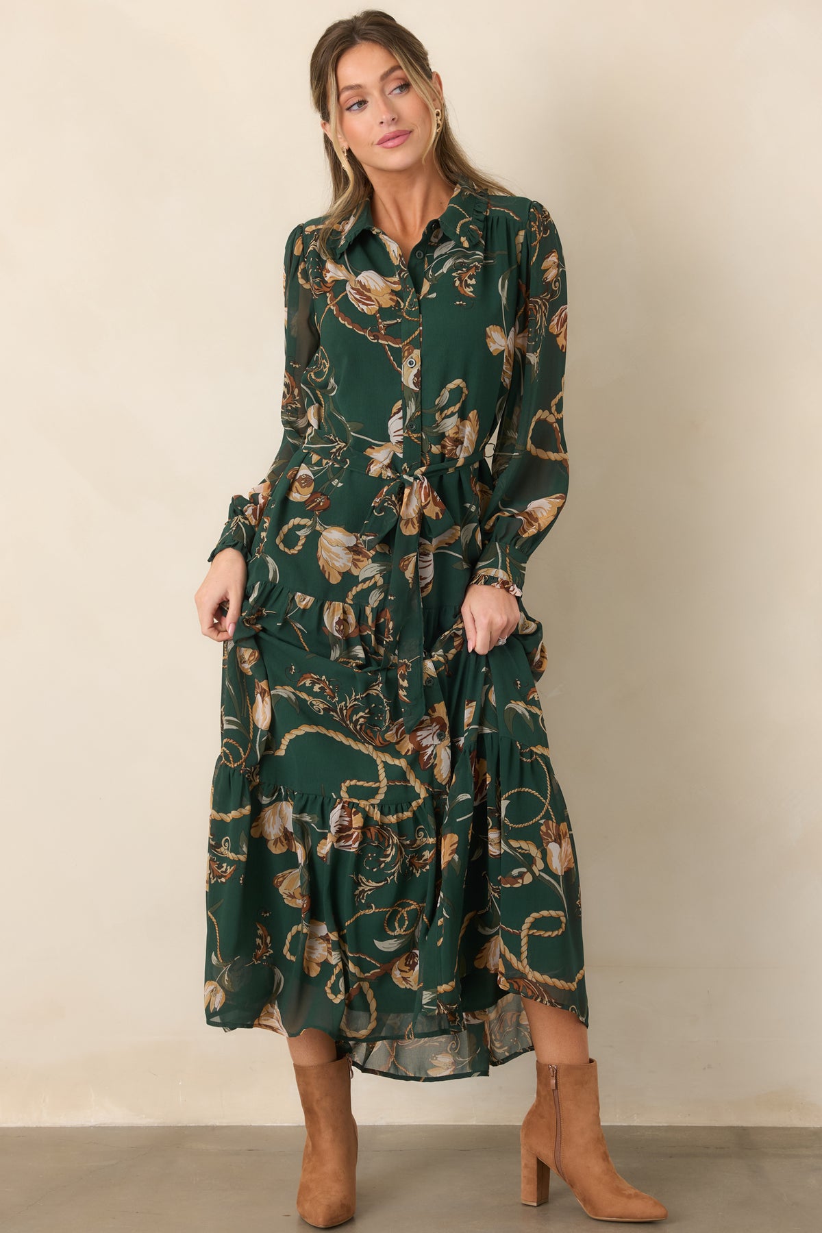 Rich green maxi dress adorned with a floral and rope-inspired print in warm camel, cream, and brown tones, finished with a defined tie waist.