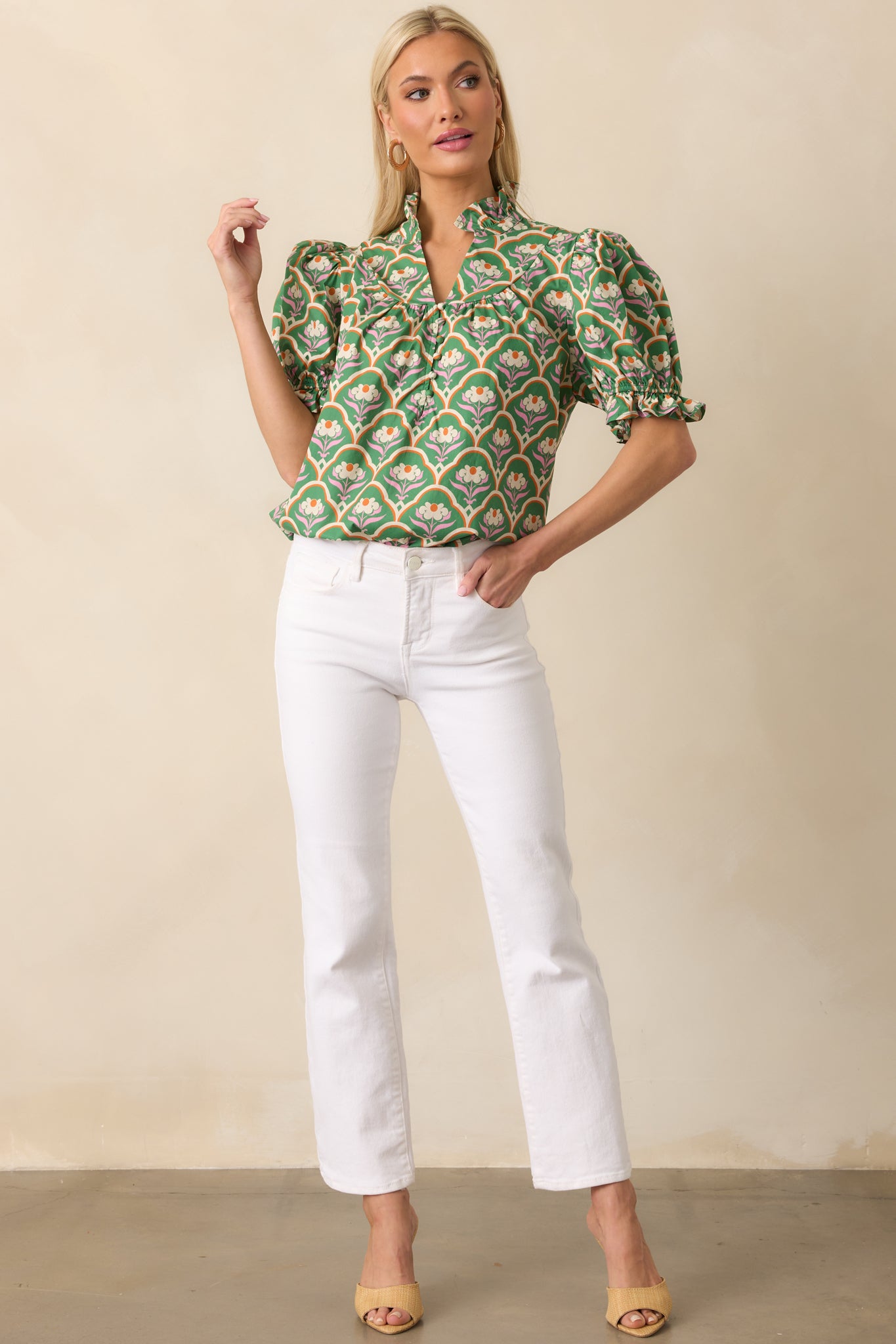 Green floral top displaying vibrant geometric print and lightweight, airy silhouette.