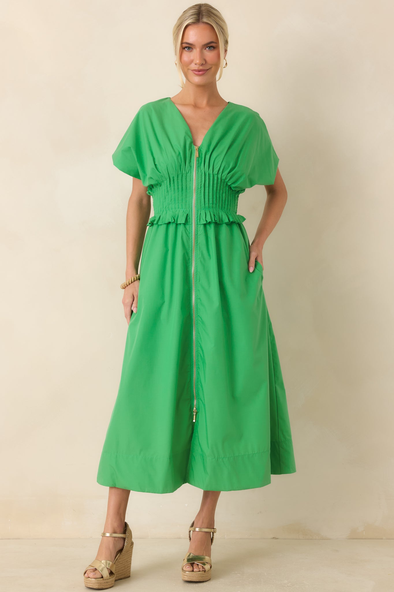 Green maxi dress featuring a soft structured shape, zip front, and relaxed A-line fit.