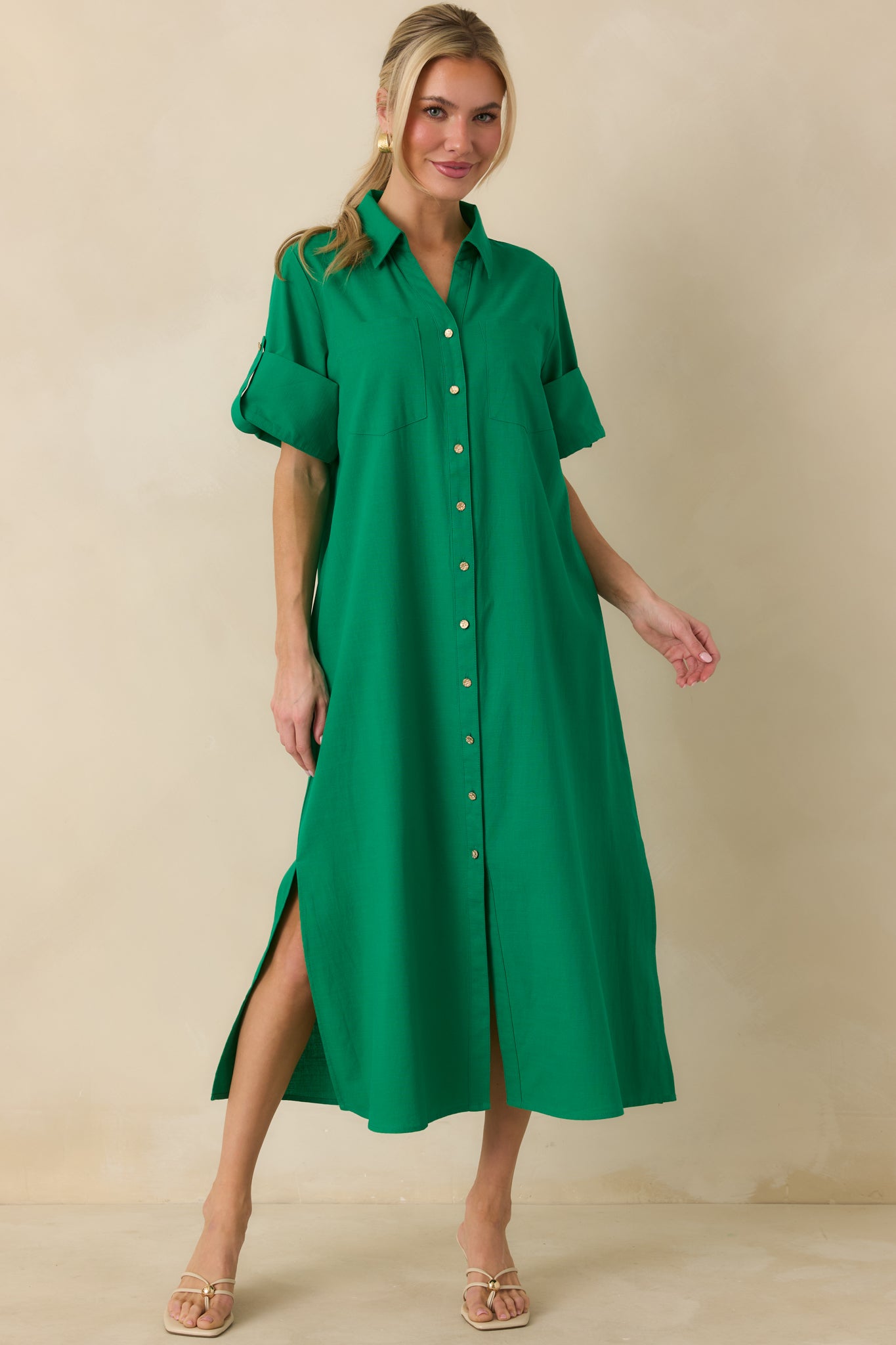 Front view of green midi shirt dress featuring a collared neckline, full button-front closure, and relaxed straight silhouette.