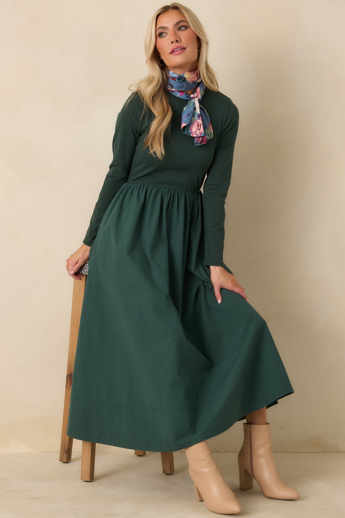 Green mixed-media midi dress with a fitted long sleeve knit bodice, round neckline, and gathered cotton A-line skirt.