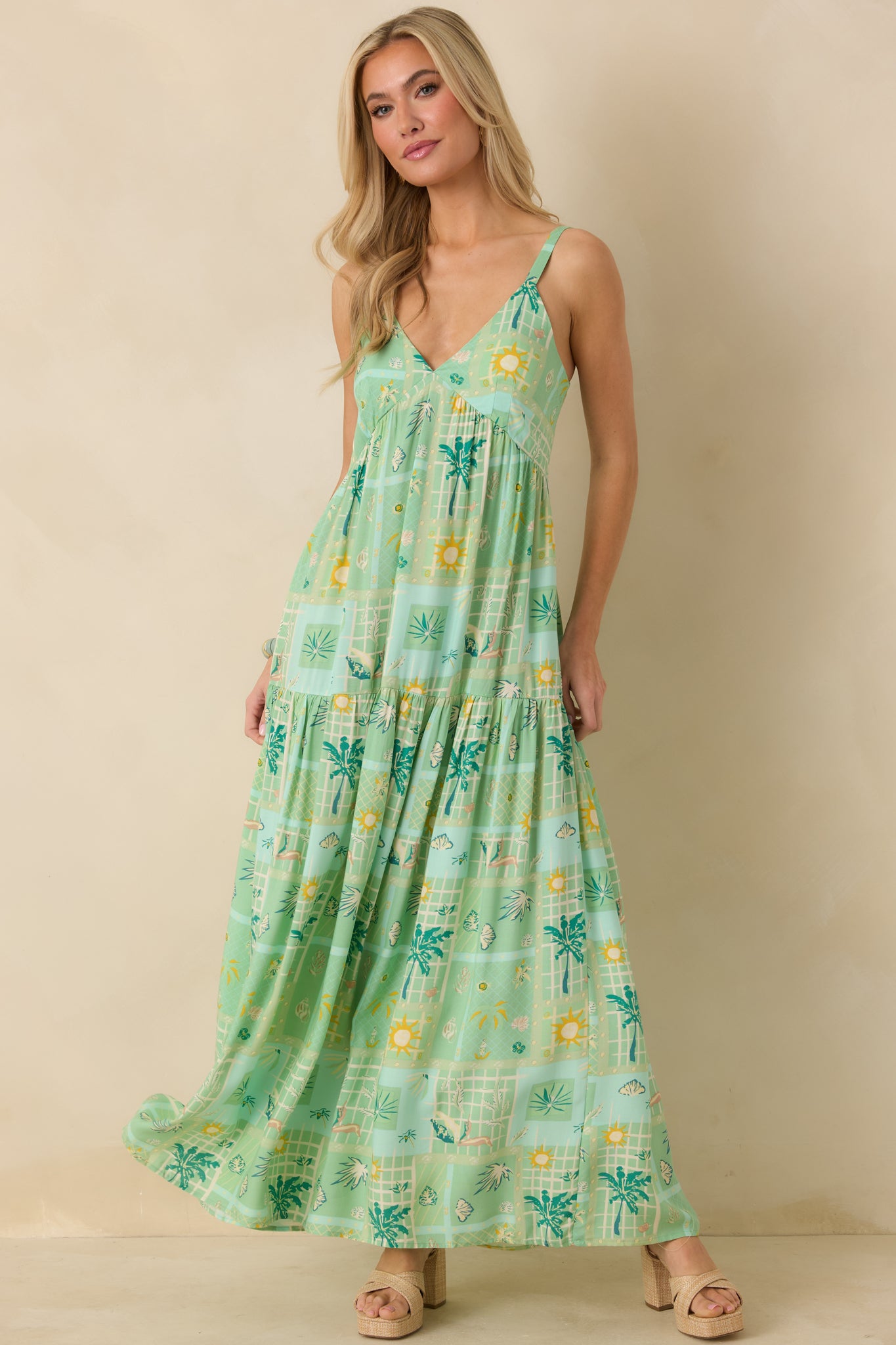 Green multicolor empire waist maxi dress designed with lightweight woven fabric and airy movement.