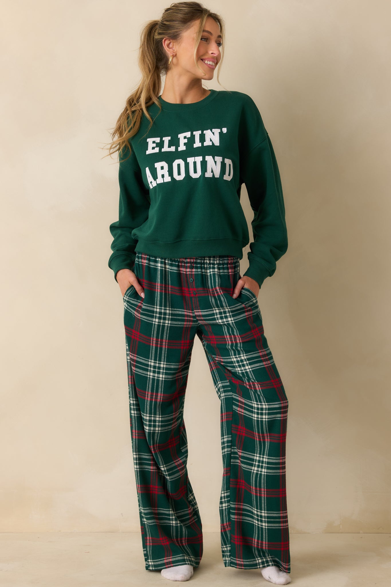 Lightweight green plaid pajama pants with straight-leg cut, soft flannel fabric, and elastic waistband for easy wear.