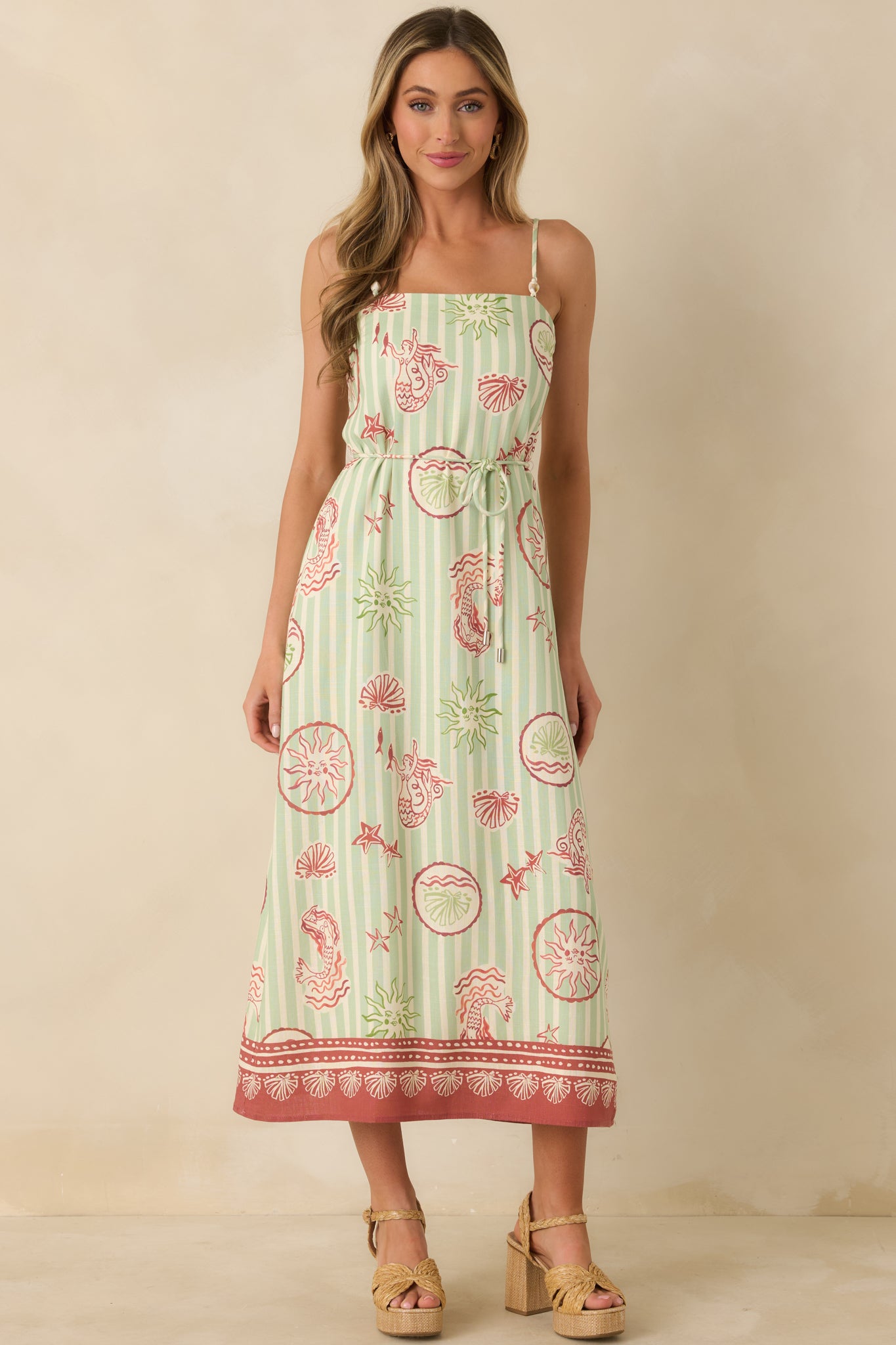 Green stripe linen-blend dress with pink seaside print and pull-on fit for effortless wear.