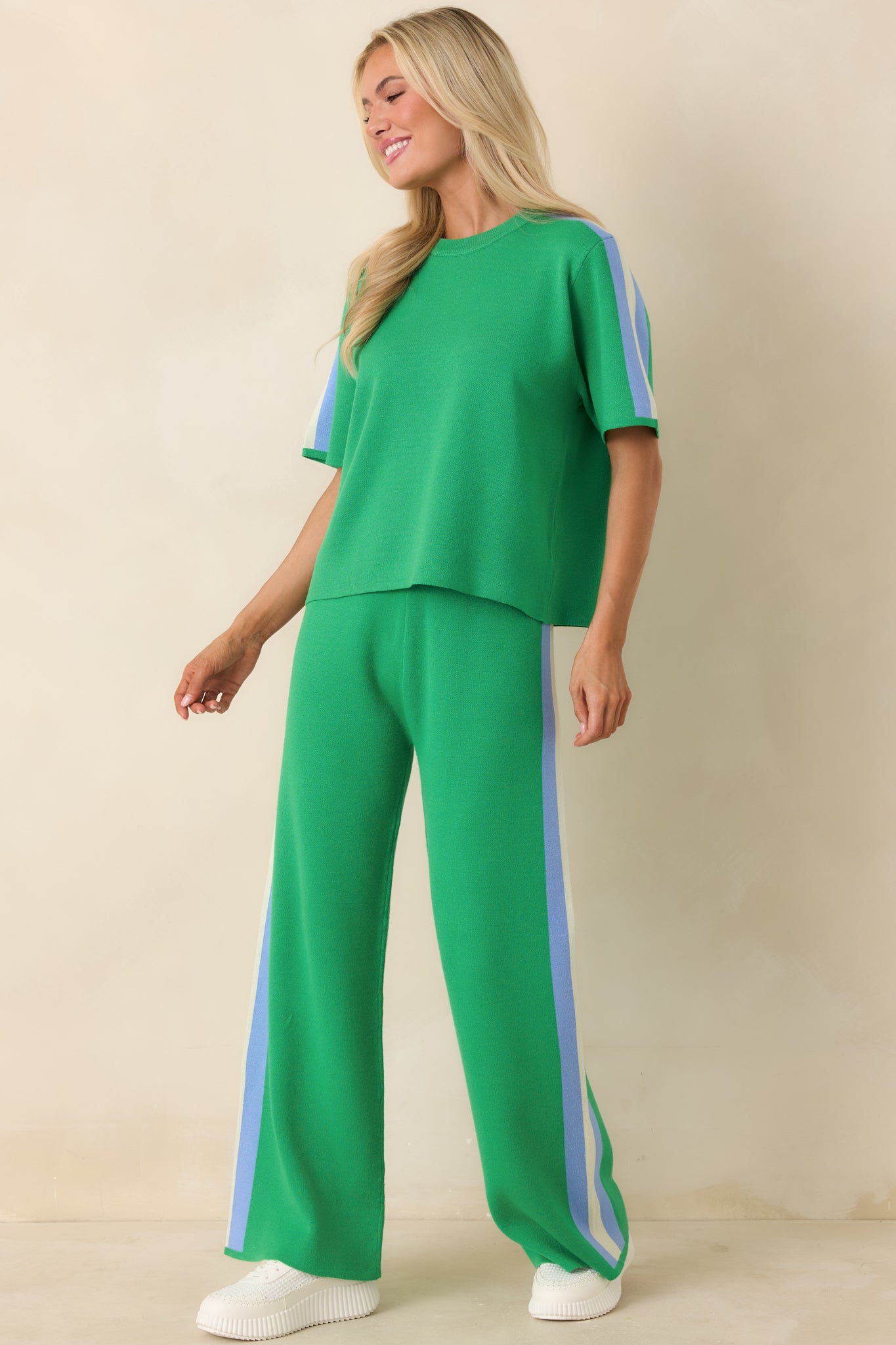 Green knit top with relaxed fit, short sleeves, and classic crew neckline.