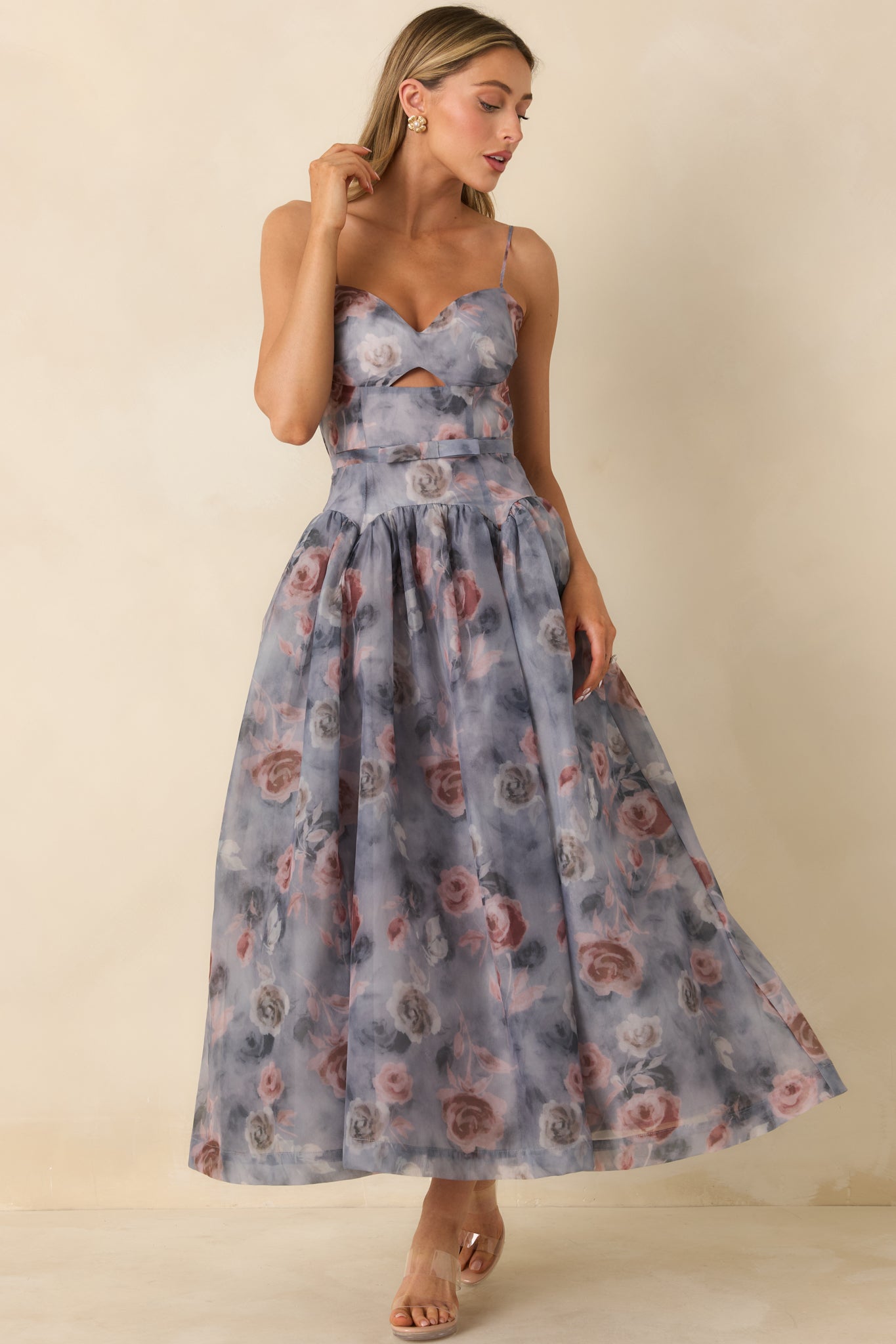 Grey midi dress featuring a fitted strapless bodice and soft, flowing floral-print skirt.