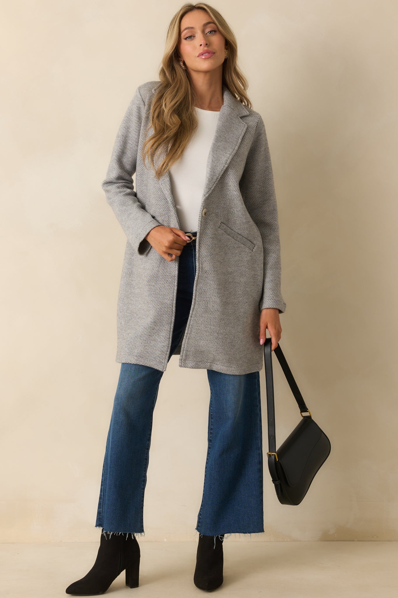 Classic grey twill coat with long sleeves, tailored shape, and clean minimalist design.