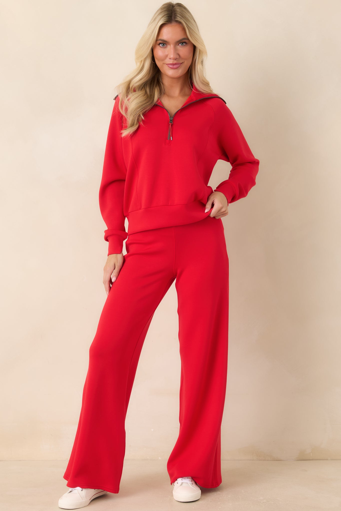 Half-zip pullover featuring an oversized collar, curved seam detailing, and a relaxed silhouette.