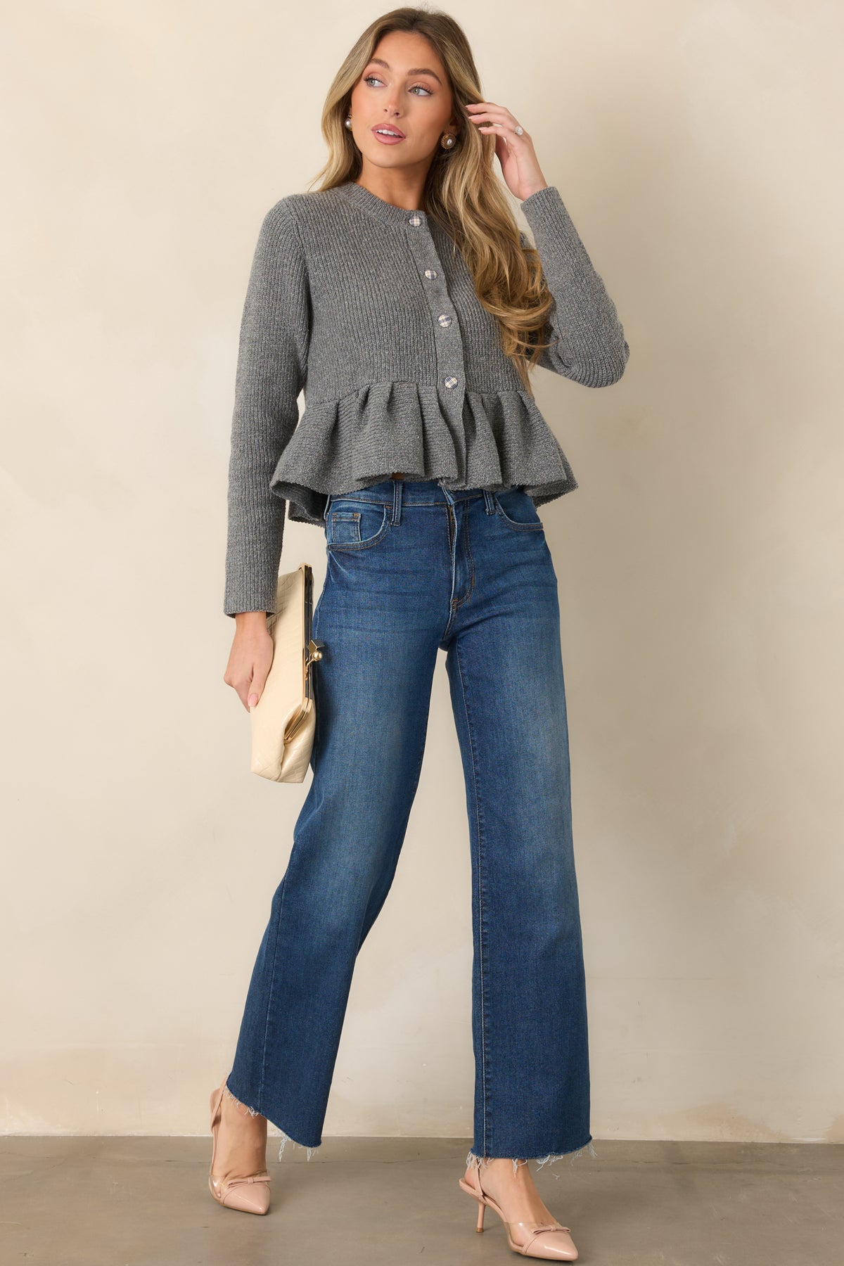 Heather gray wool-blend cardigan showcasing long sleeves, a classic round neck, plaid button closures, coordinating trim, and a polished peplum shape.
