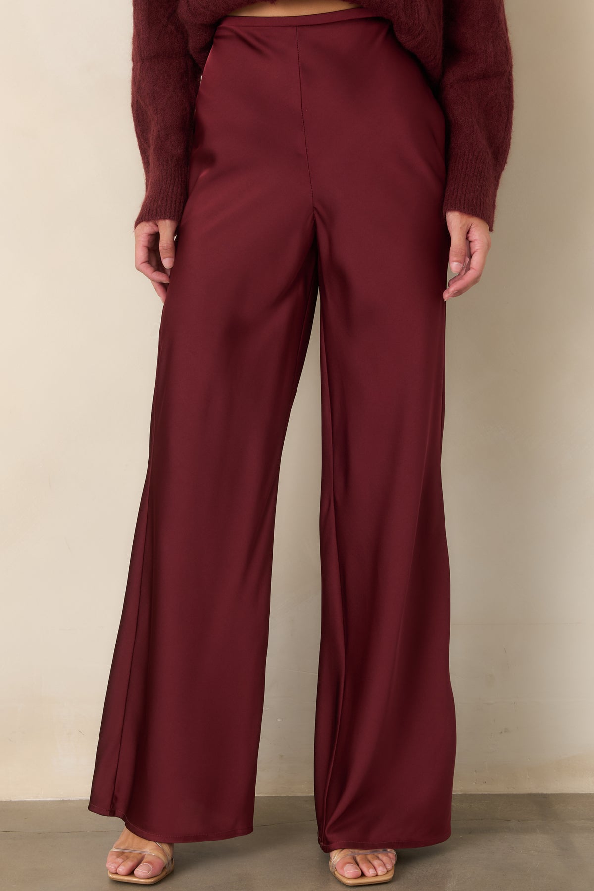 High-rise wide-leg pants featuring a clean waistband and graceful movement through the legs.