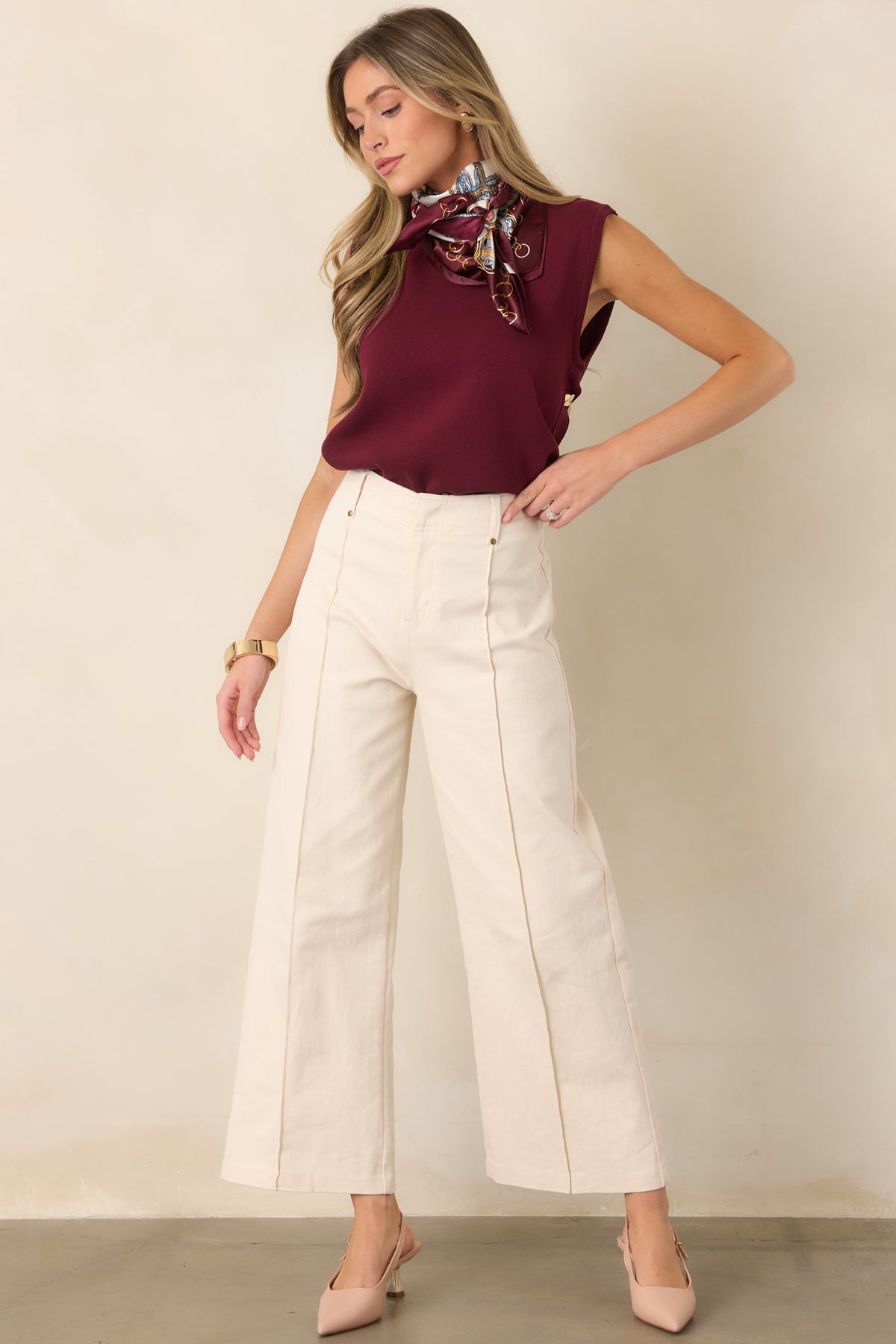 High-rise cotton-blend pants with a streamlined silhouette, sewn front pleats, and functional belt loops.