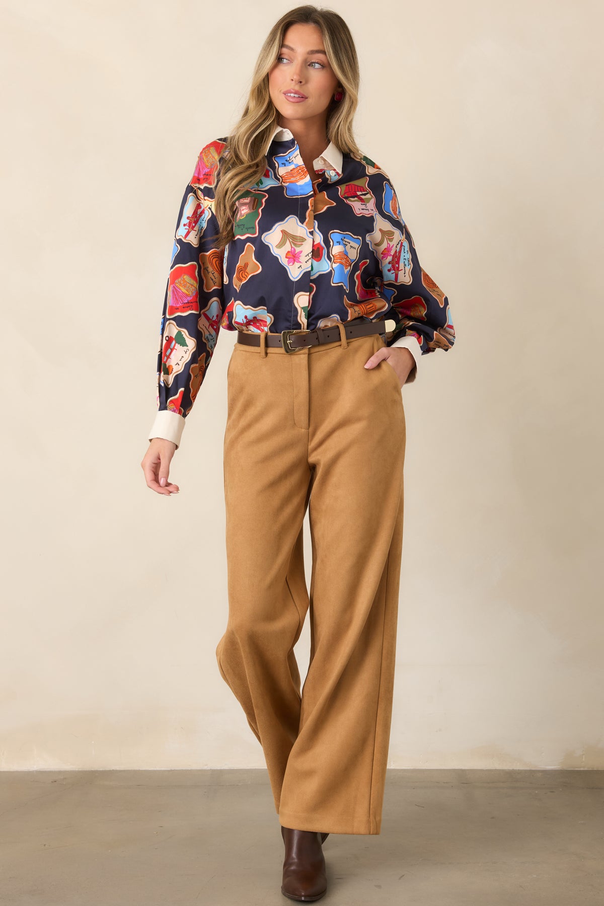 Full-length wide-leg pants showcasing a clean high-rise fit, comfortable elastic back waist, practical side pockets, and streamlined tailored shape.