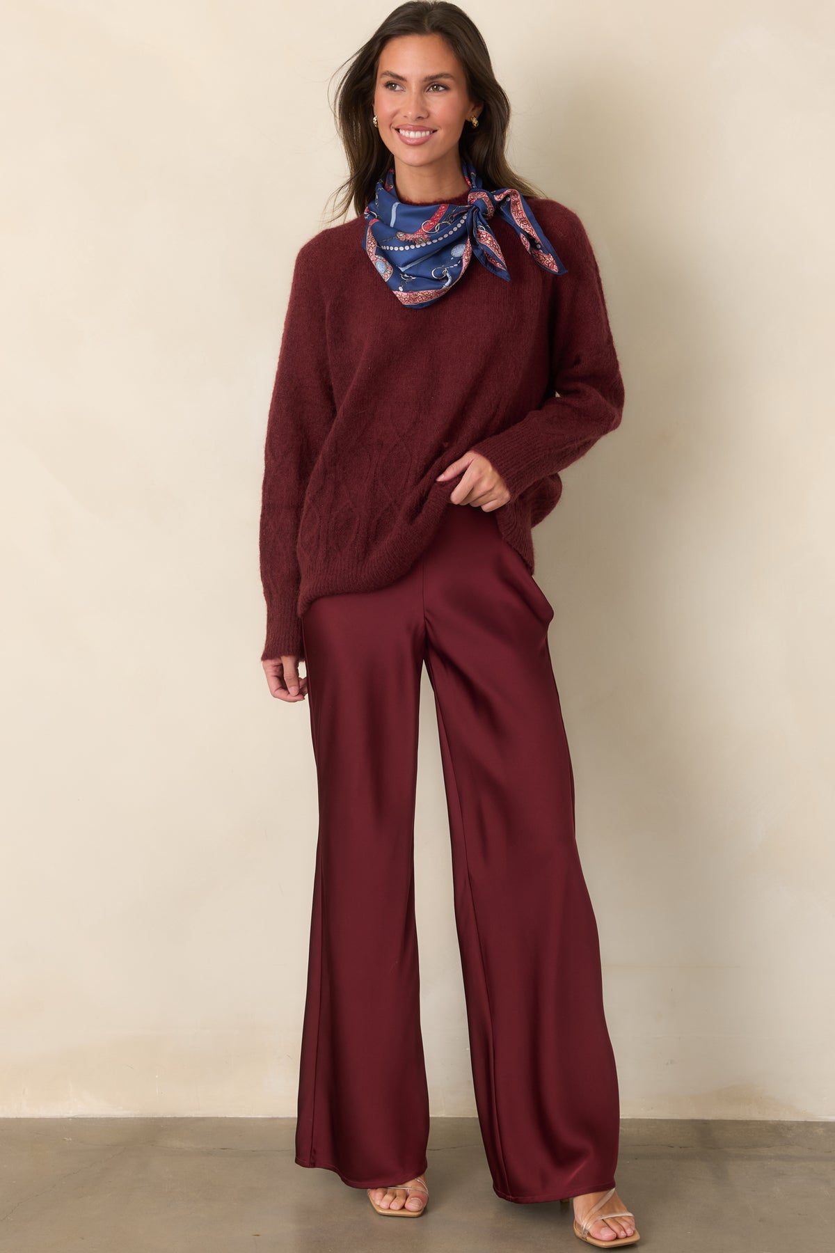 A polished pair of high-rise pants featuring a flat-front waistband and flowing wide-leg silhouette.