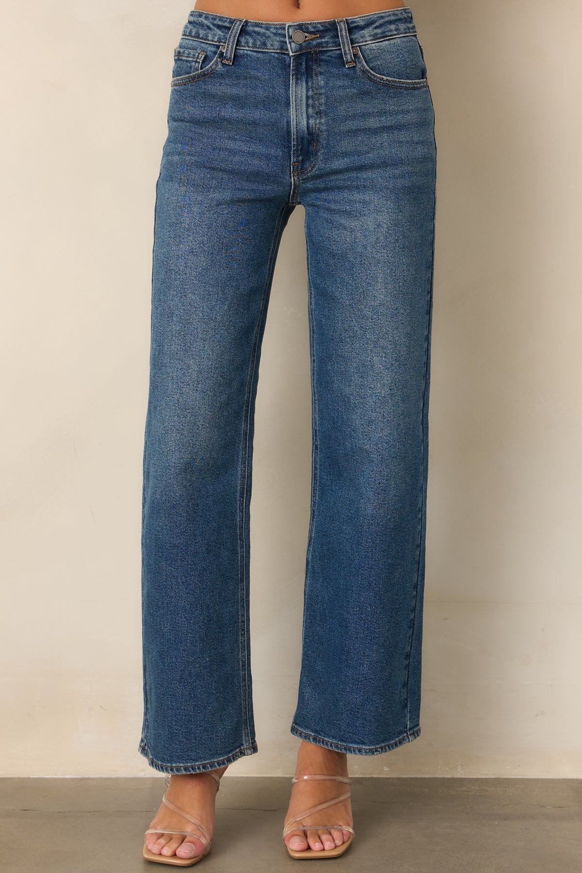 High-rise jeans showcasing the relaxed straight leg shape and medium wash.
