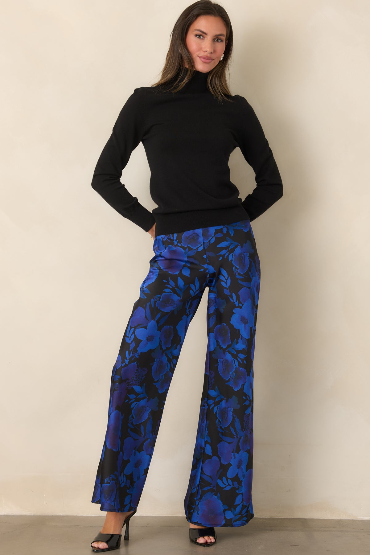 High-rise polyester satin pants featuring an eye-catching blue and violet floral pattern and full-length wide legs