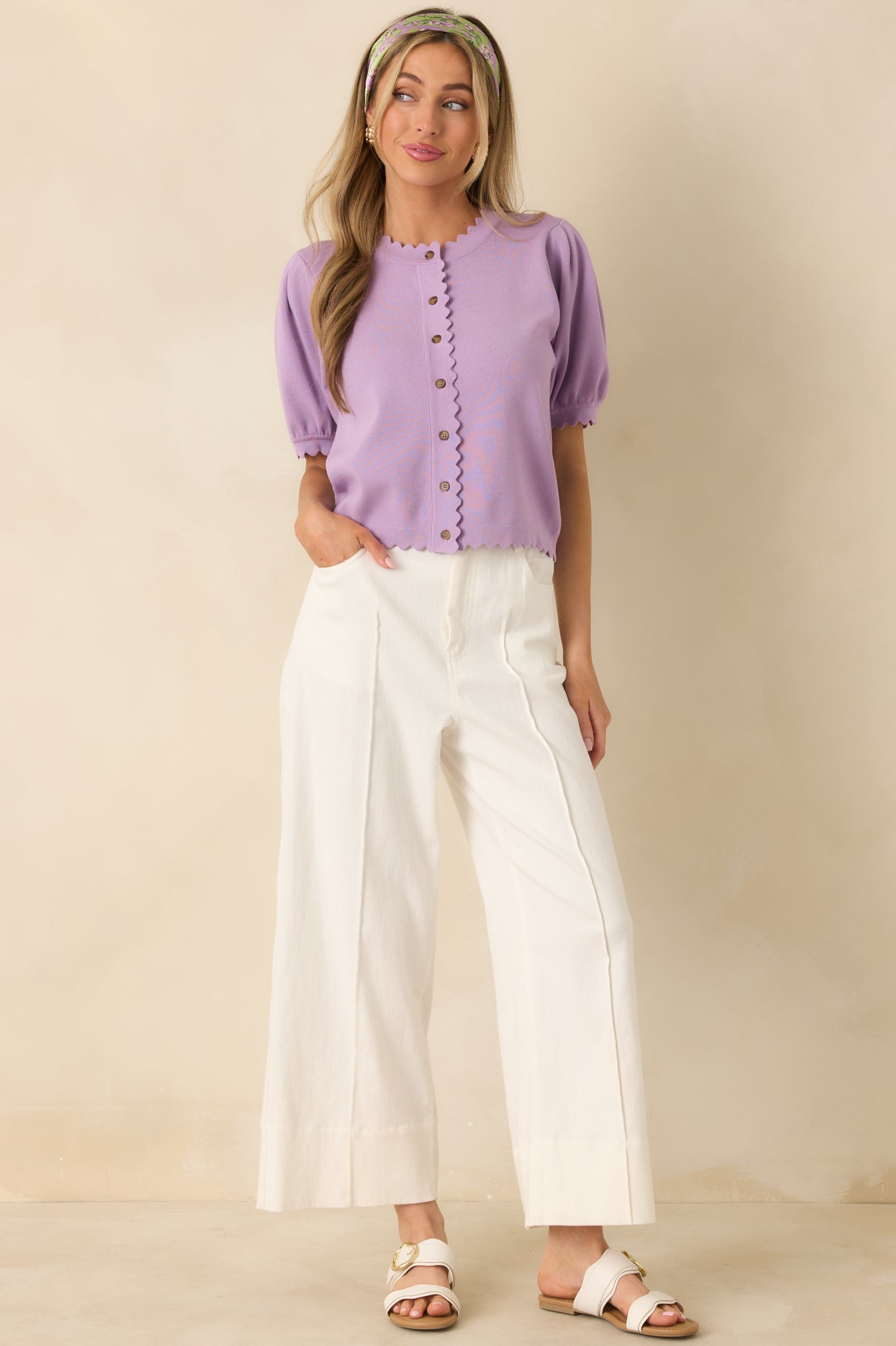 High-rise woven cotton pants in white, cut for a relaxed fit through hip and thigh.