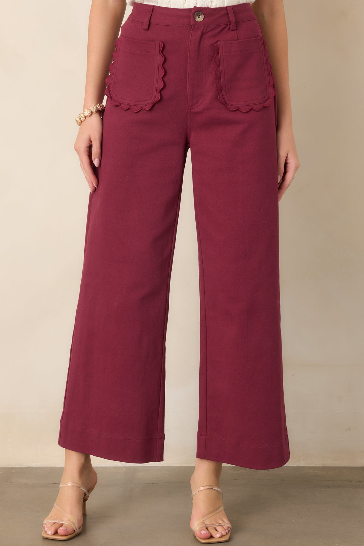 High-rise wide-leg pants showcasing the breathable woven cotton fabric, defined waistband, and neatly finished front pockets.