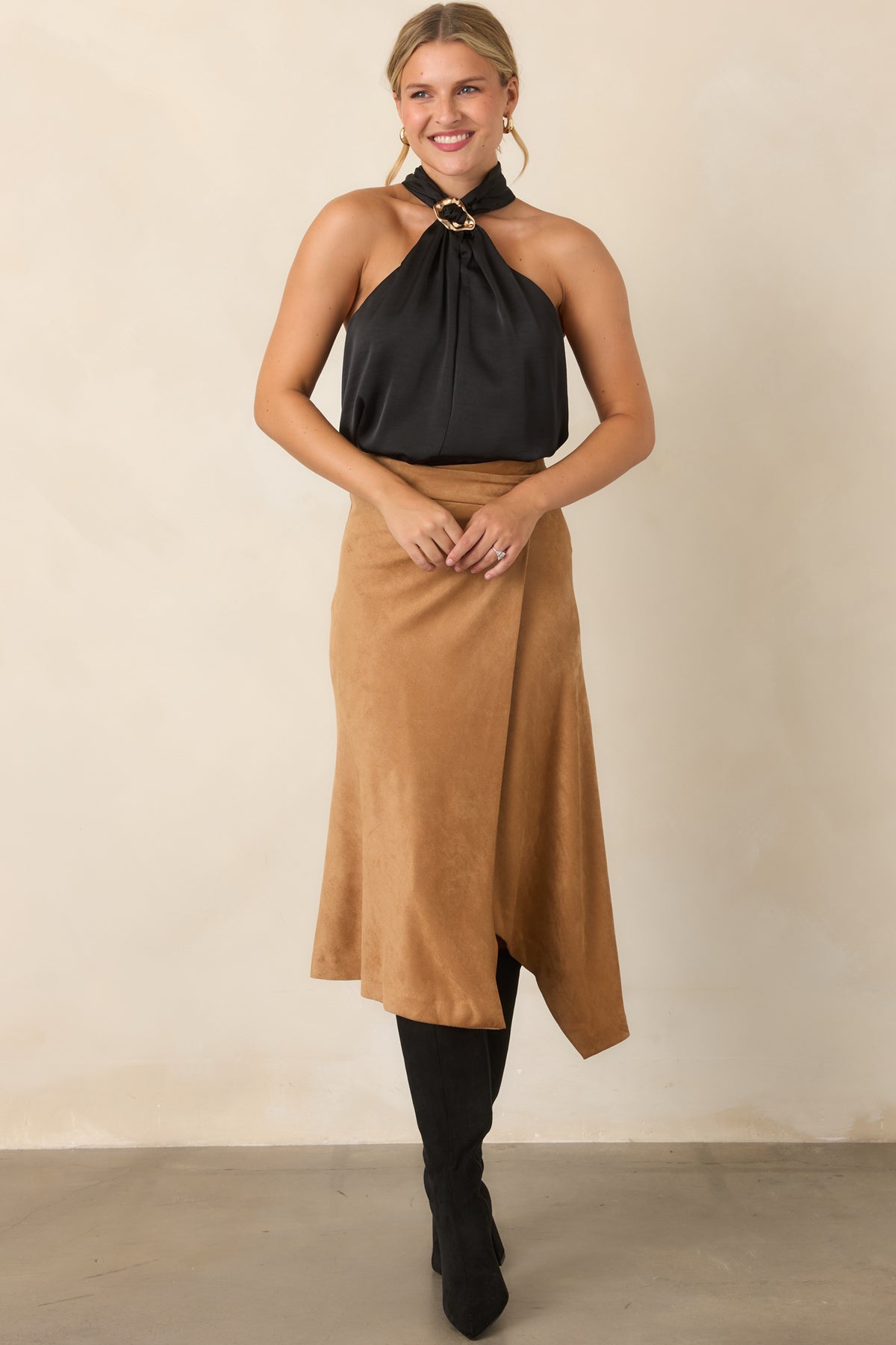 High-rise wrap skirt with a graceful asymmetrical front and clean streamlined back.