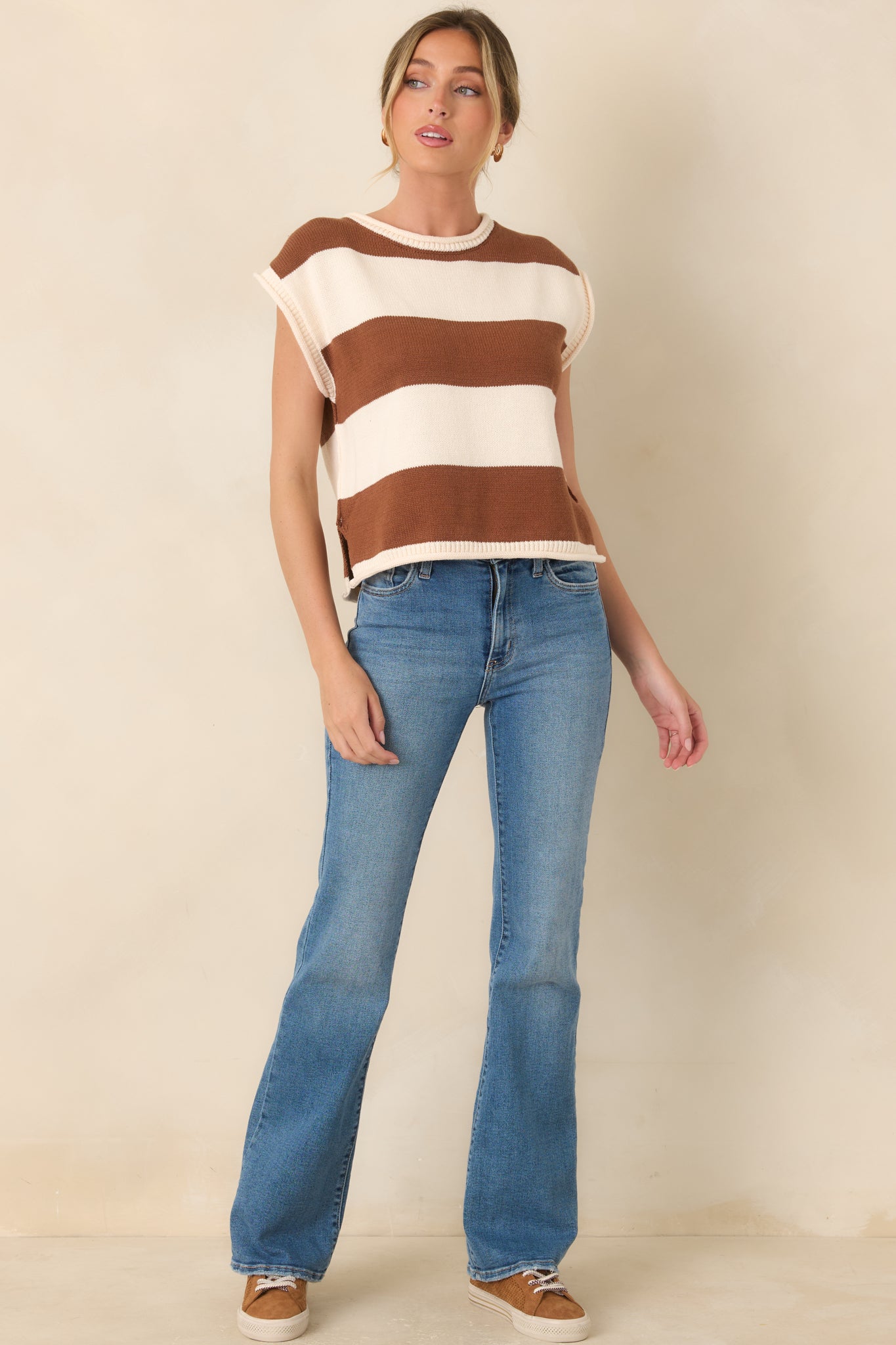 Lightweight striped knit top showcasing its comfortable short cap sleeves, rounded neckline, and easy everyday silhouette.