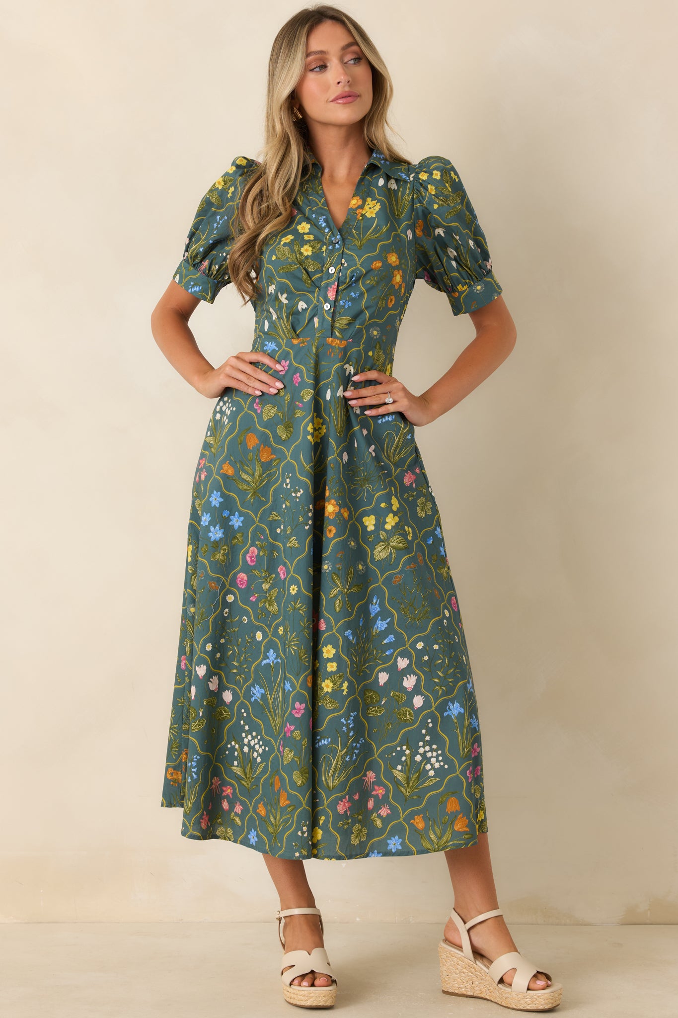 Hunter green floral midi dress featuring a functional button-front bodice, adjustable waist sash, and a graceful skirt with effortless movement.